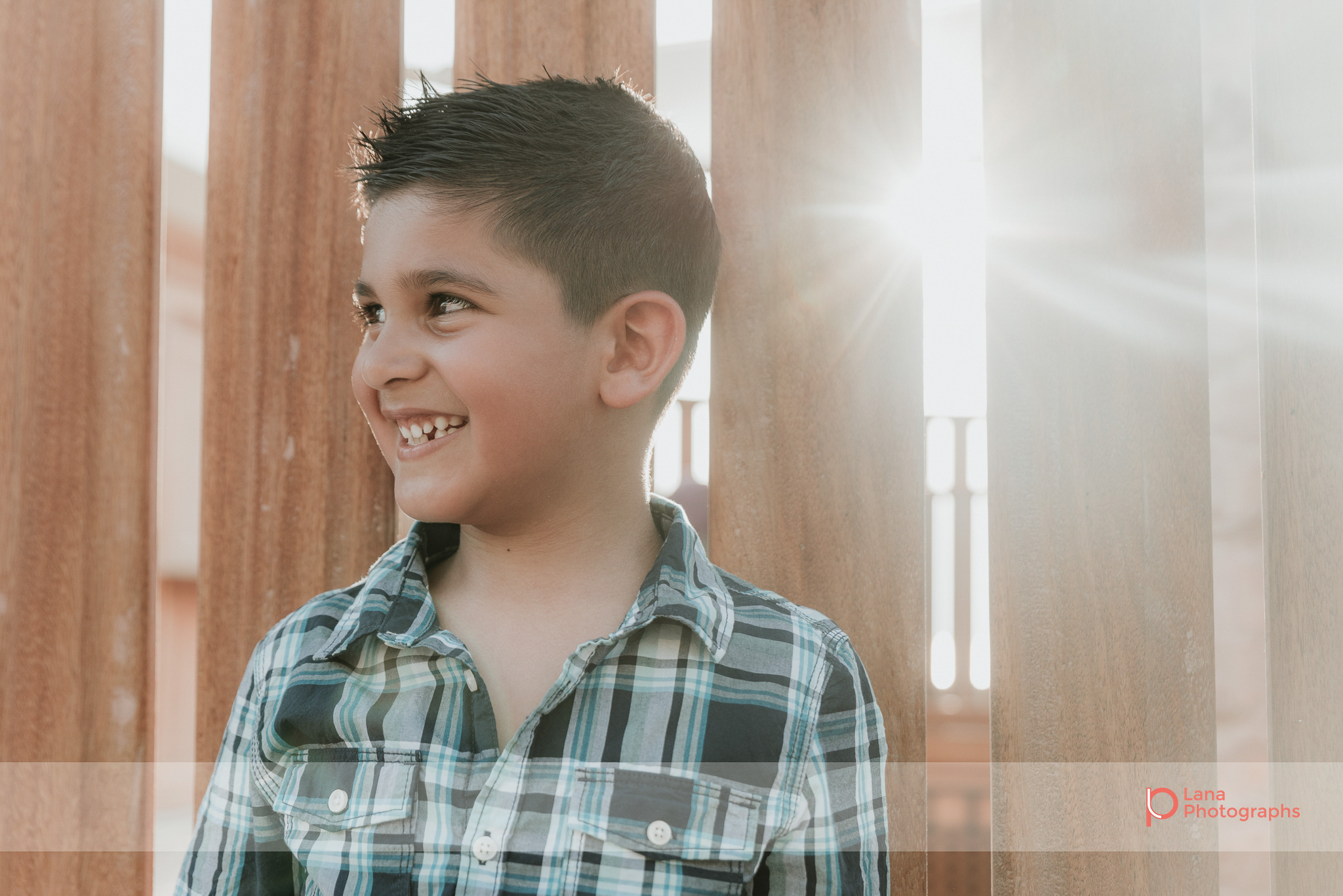  Lana Photographs Dubai Family Photography beach photoshoot portrait of young boy in the sun flare 