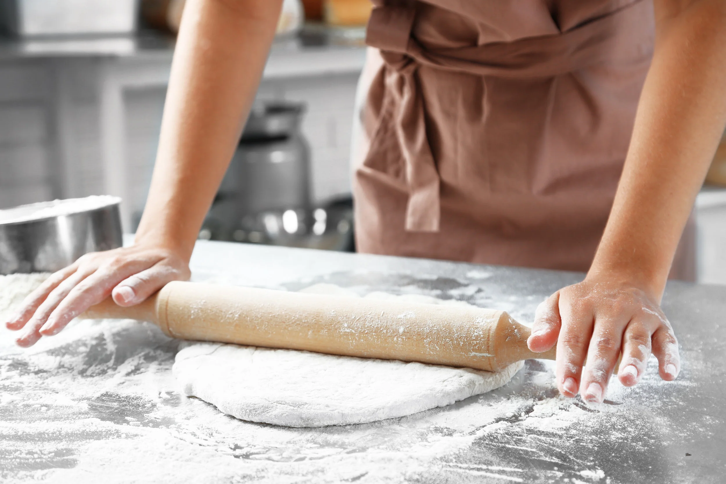 stock-photo-making-dough-by-female-hands-at-bakery-316732952.jpg