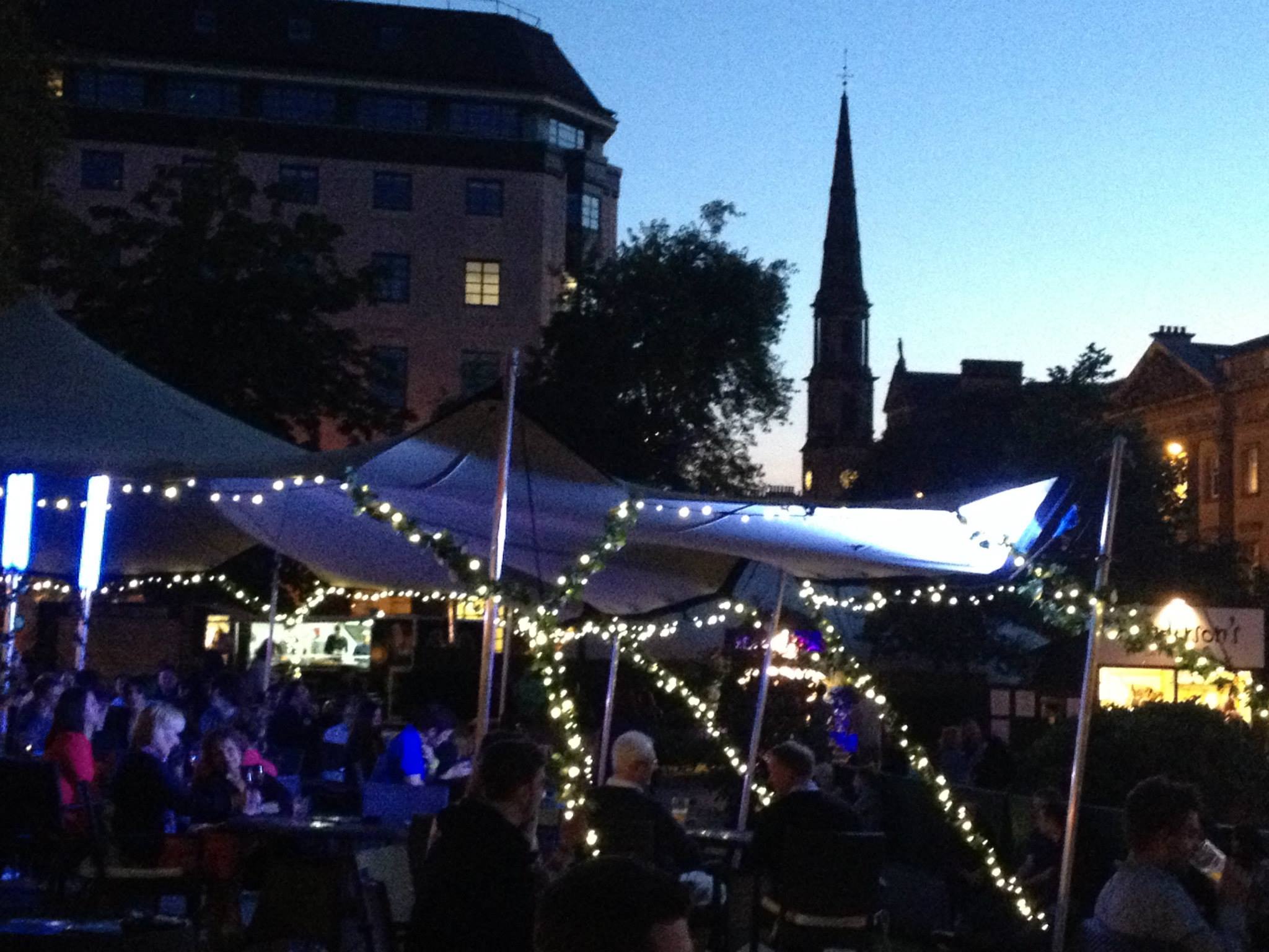 (St. Andrew's Square in the evening during Fringe)