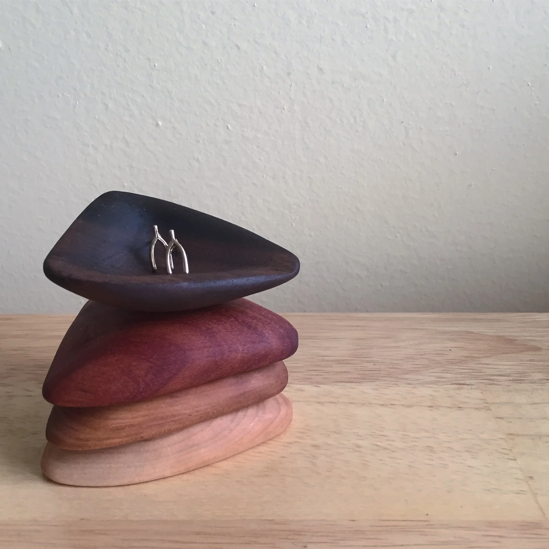  triangle catchalls in walnut, cherry, mahogany, and maple 