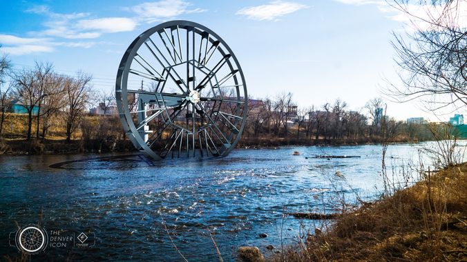 RiNo landowner’s forecast calls for 50 percent chance of huge water wheel "The proposal is to build a 50-foot wheel that would spin with the river’s flow. Its backers say it could provide renewable power to the RiNo Promenade, a mile-long park set for construction along the banks of the river. A separate, floating component would be anchored in the river to collect trash and prevent debris from entering the wheel." 8/16/18 Denverite
