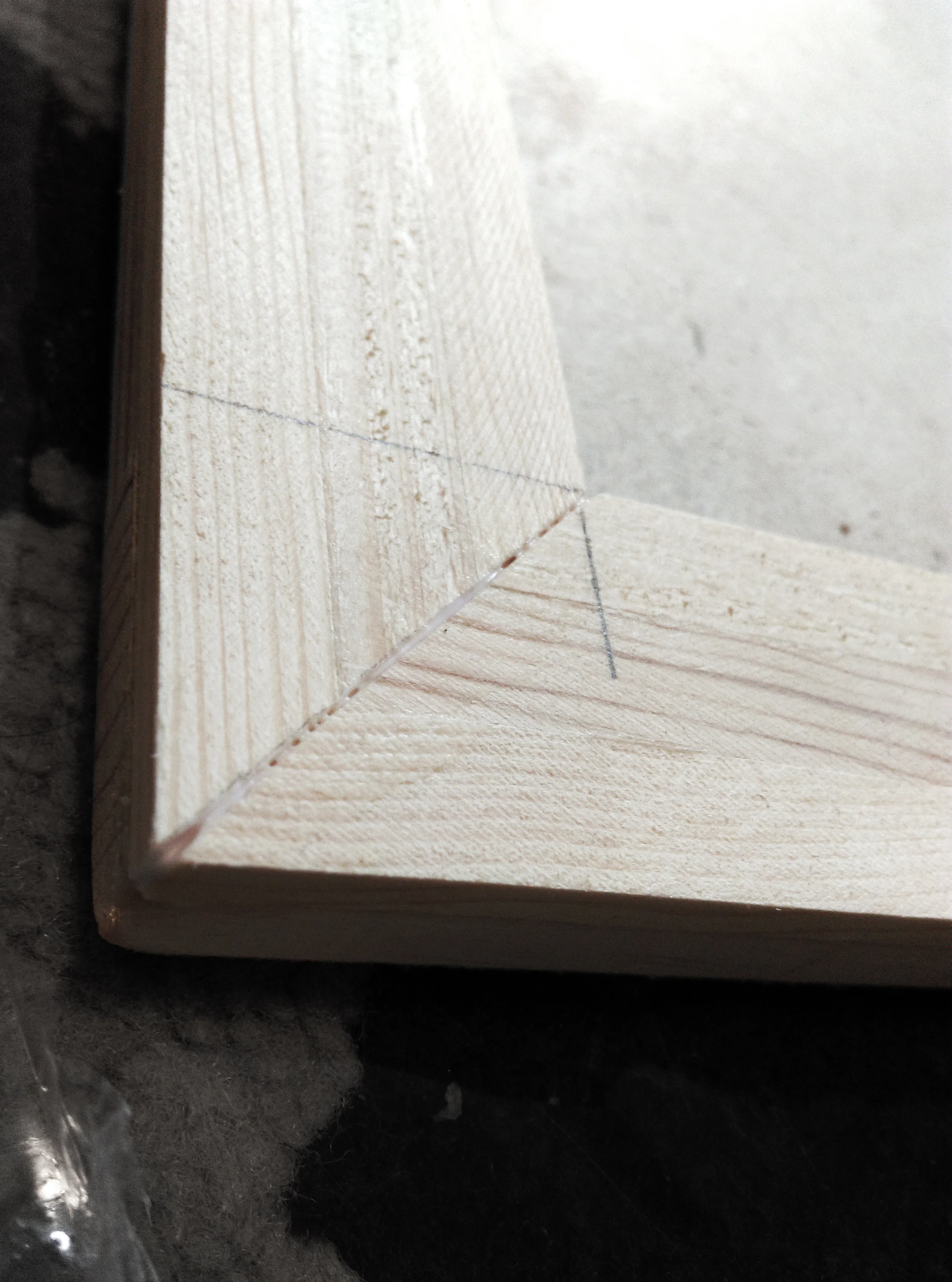Corner closeup, the seam would be later filled with more glue and sand once more before prepping for paint.
