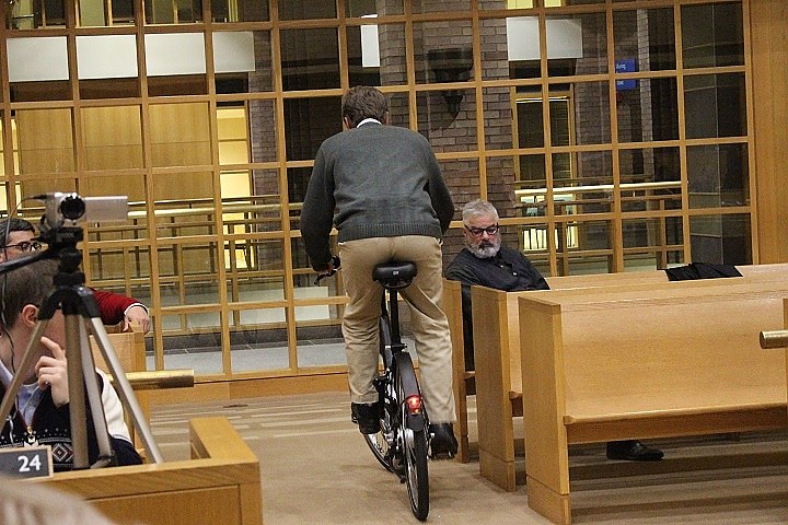 Legislative rider: Alder Adam Marchand samples prototype at hearing.
