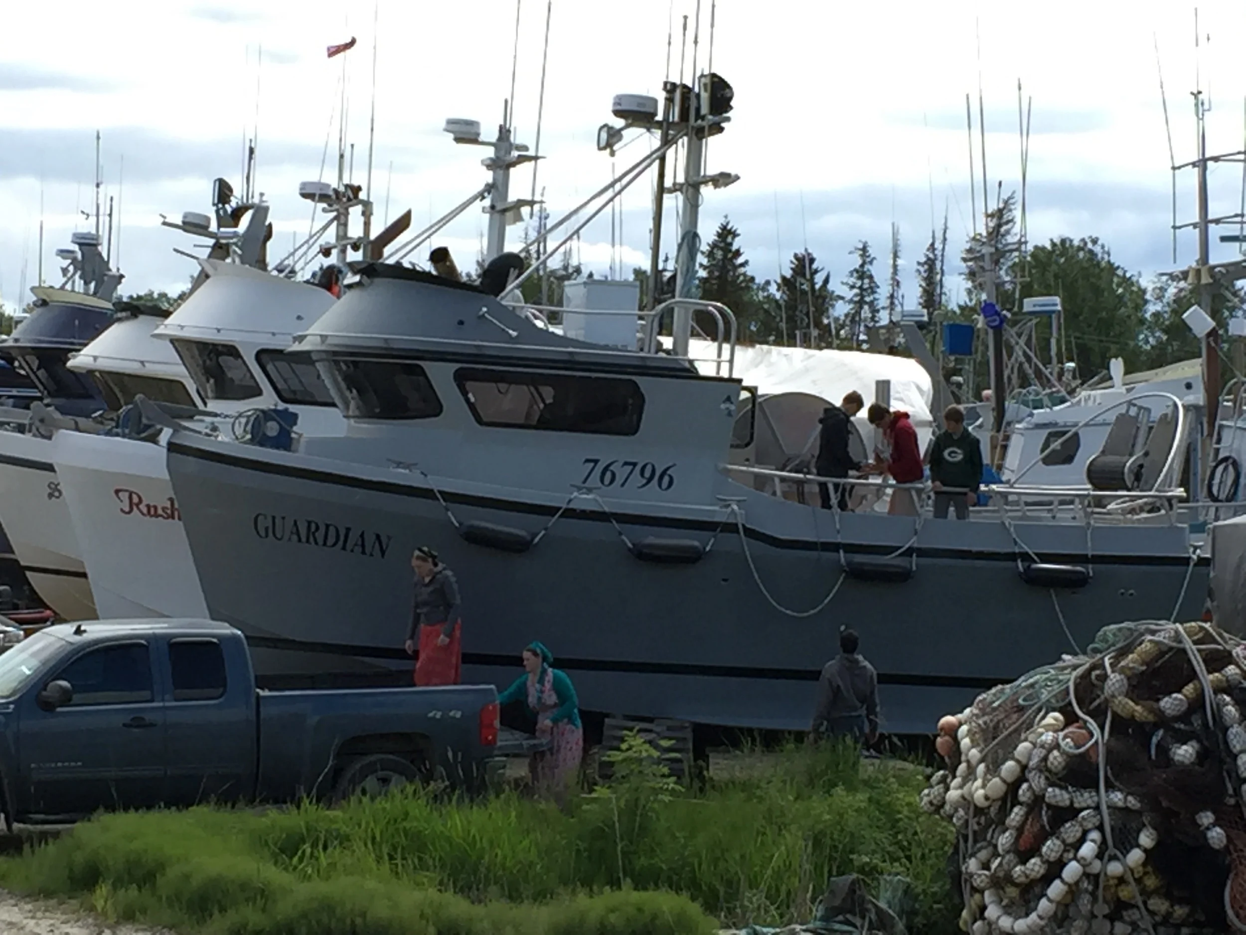 A family bucket brigade outfitting a gillnetter for the upcoming salmon season.