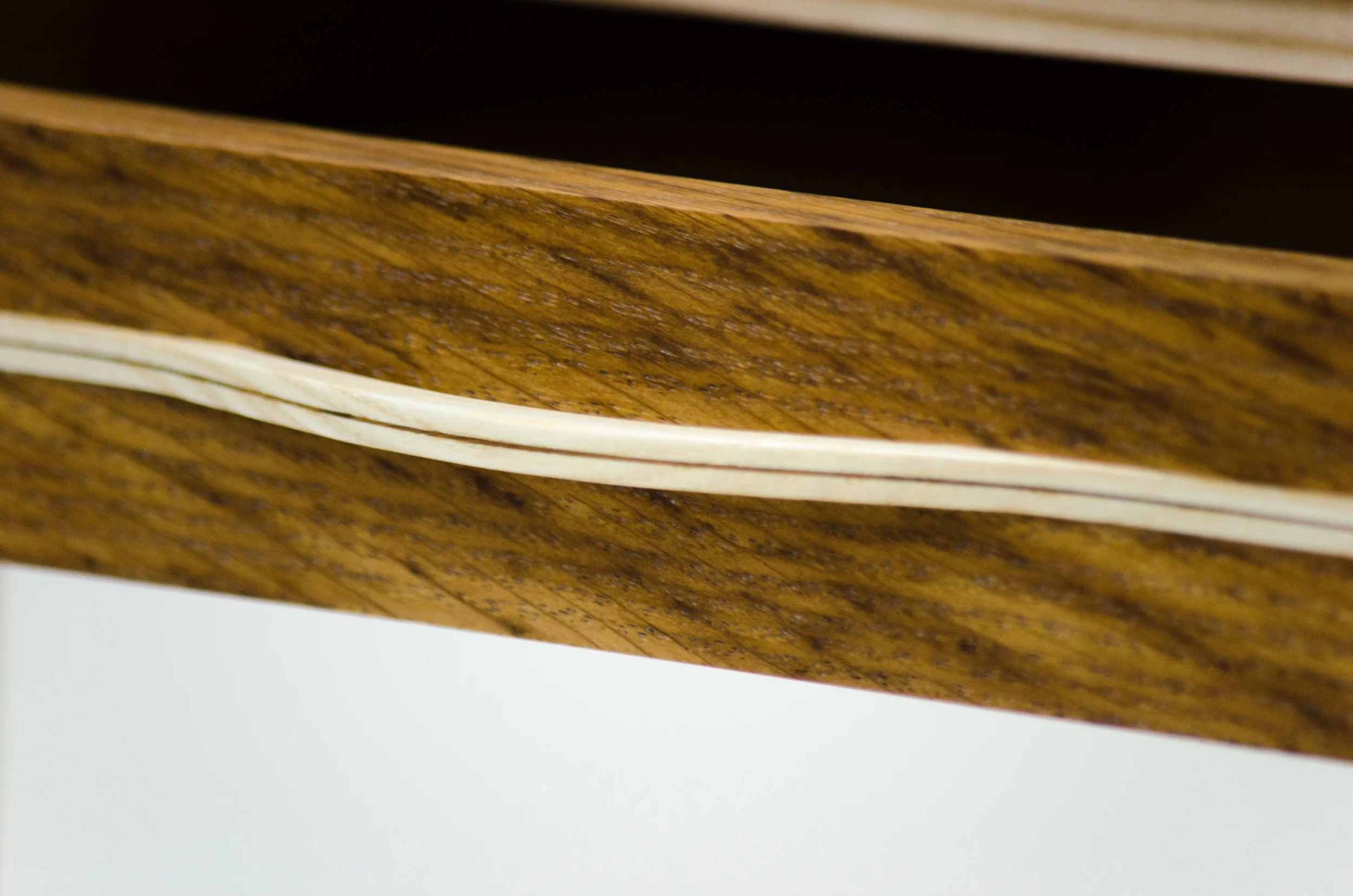  The inlay on the stripe table also forms the drawer pull. 