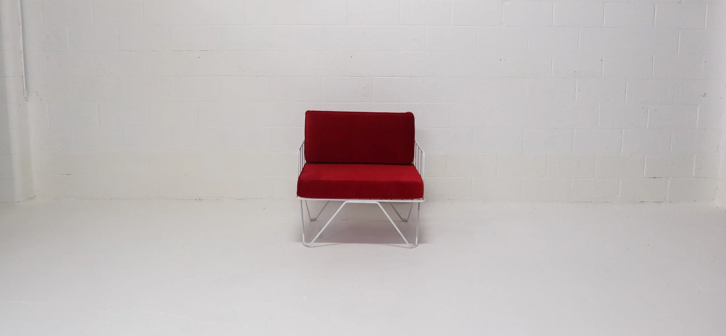 White Loop Armchair - Red Cushion