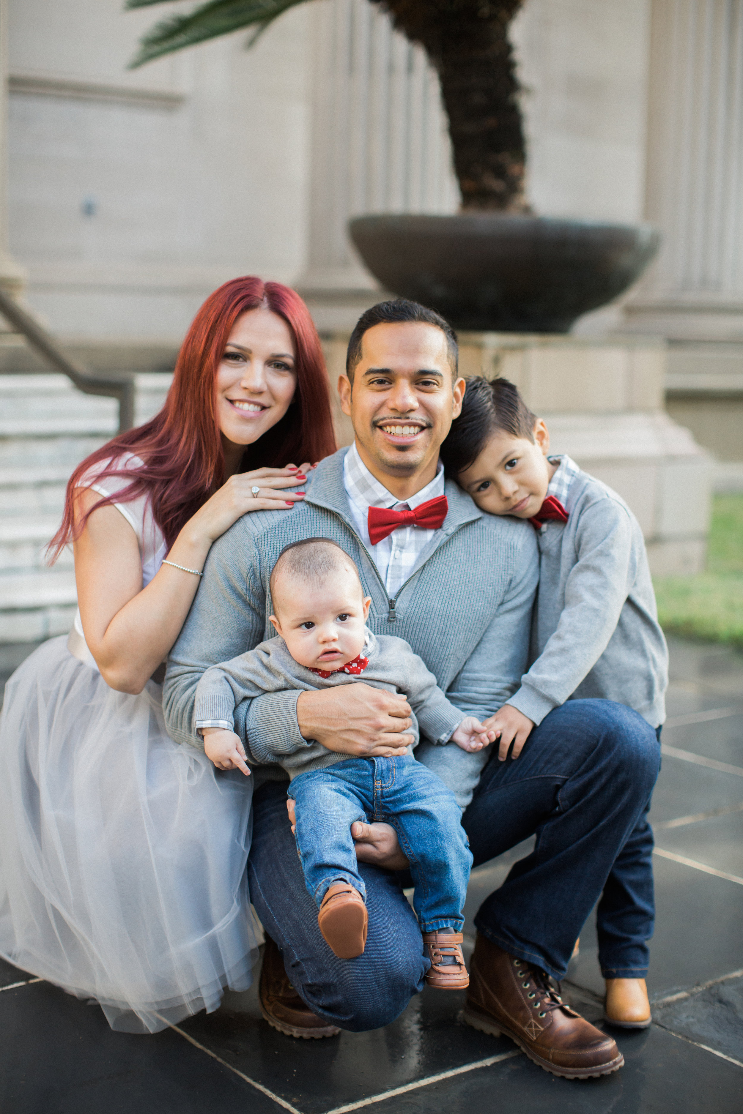 Once again I get to photograph the wonderful Rojas family for the Holidays. After a number of bad weather days in Houston, we managed to squeeze in one hour of shooting. The day was gloomy, wet and a bit windy, however the Rojas family stuck it out! I was able to capture some adorable family portraits of them. I am always excited for our annual photo sessions and cant wait for the next round. This time was a bit different and exciting. I would be meeting the new member of the family in person. Here are a few of my favorite images. Enjoy!