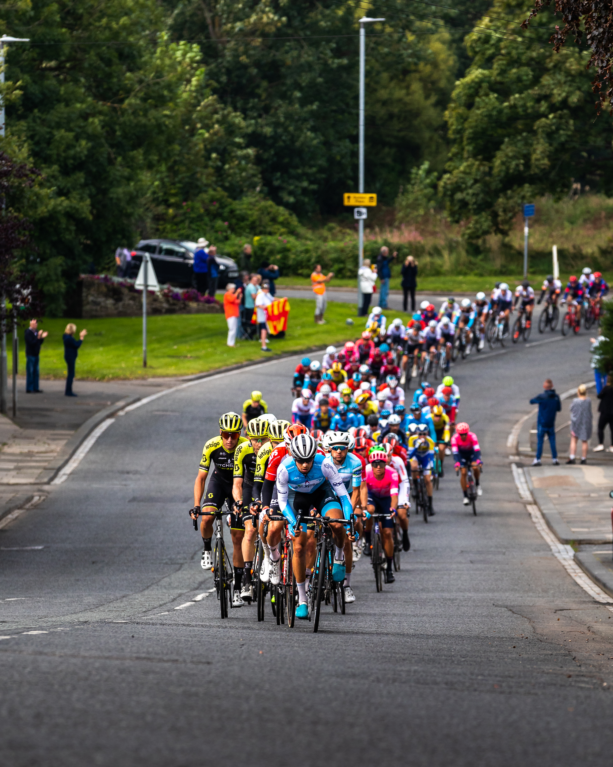  The peloton approaches the top of The Wynd, Amble. 