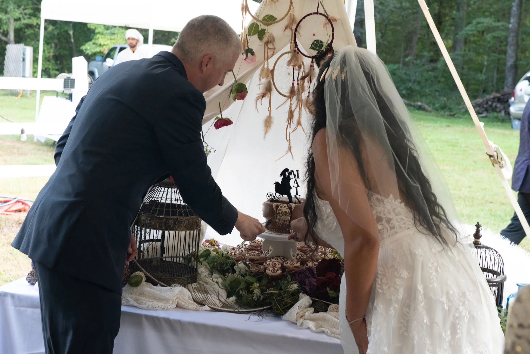 Karmetria and Jason cut cake.jpg