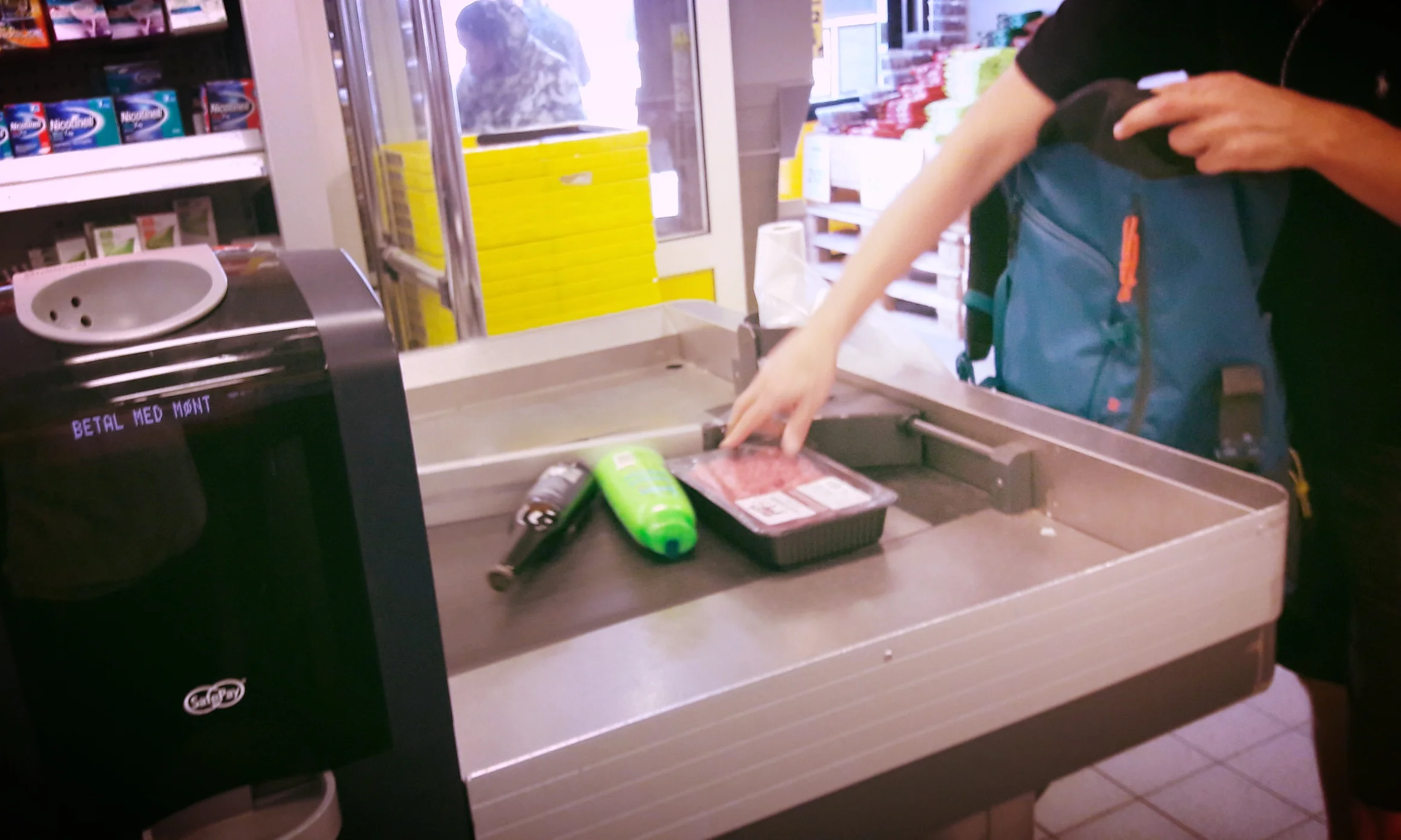Your groceries will be either swiped left or right by a long metal divider so the cashier can start serving the next customer in line.