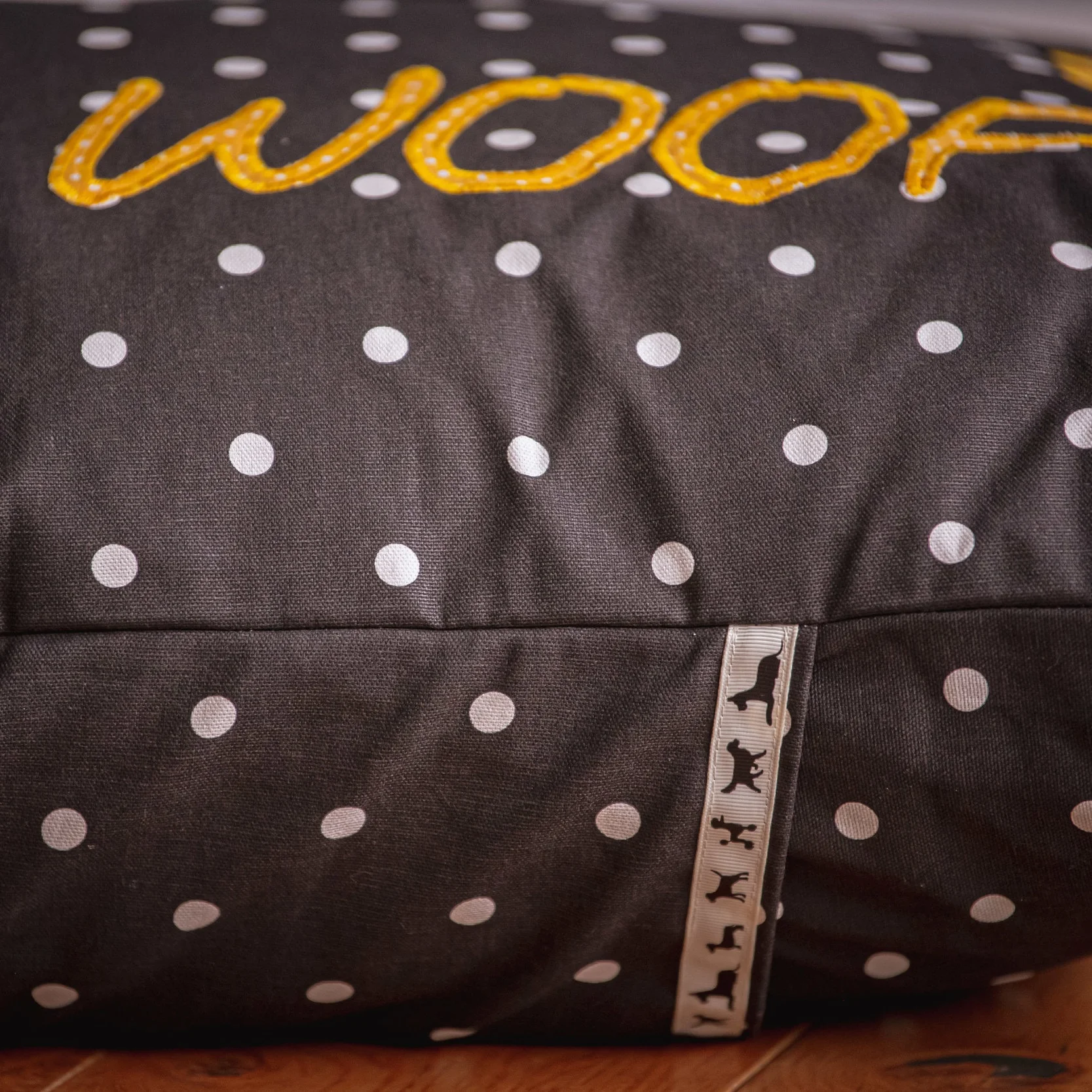 Throw cushion in Charcoal L spot fabric