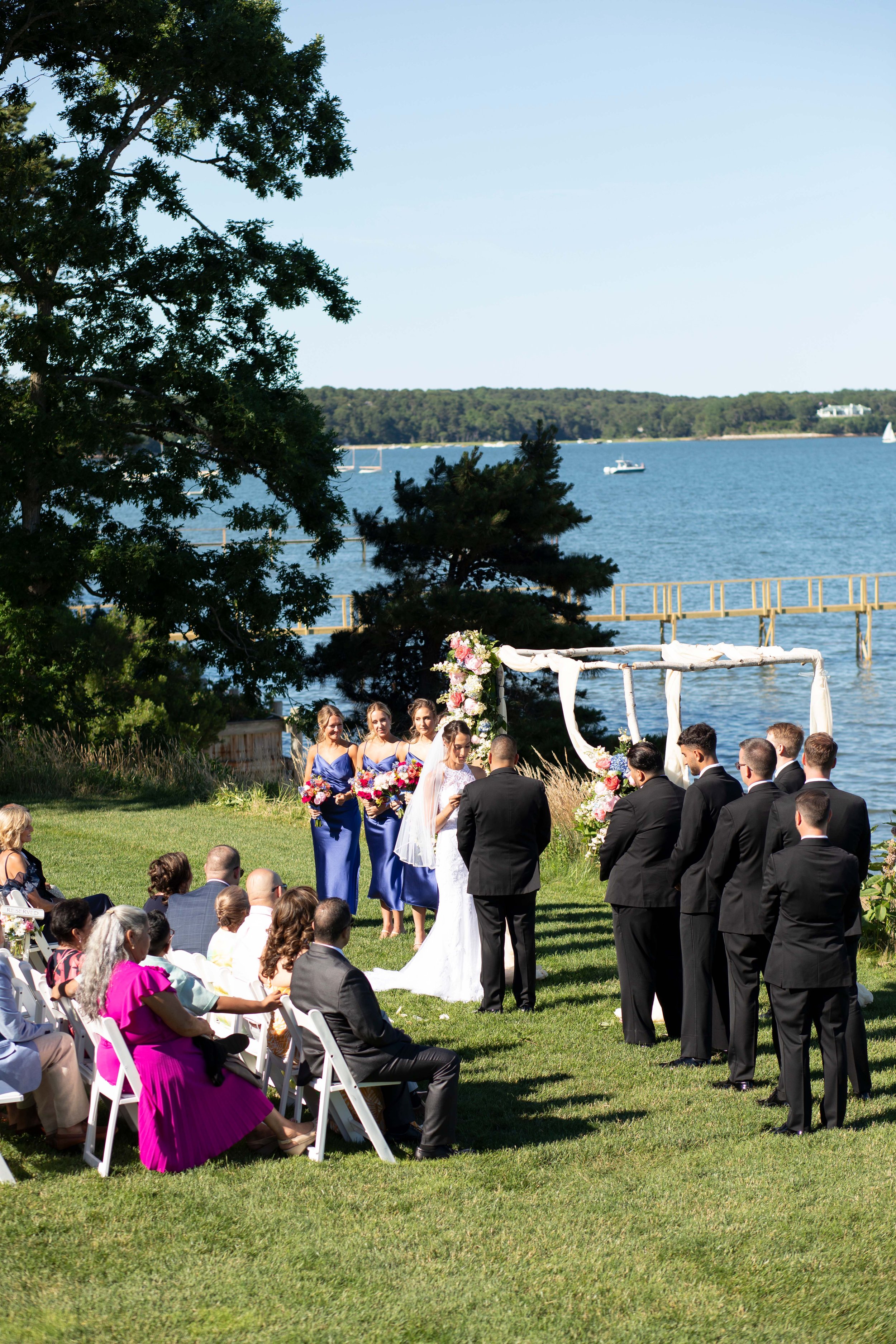 cape cod wedding wequassett wedding outdoor ceremony overlooking harbor sideview