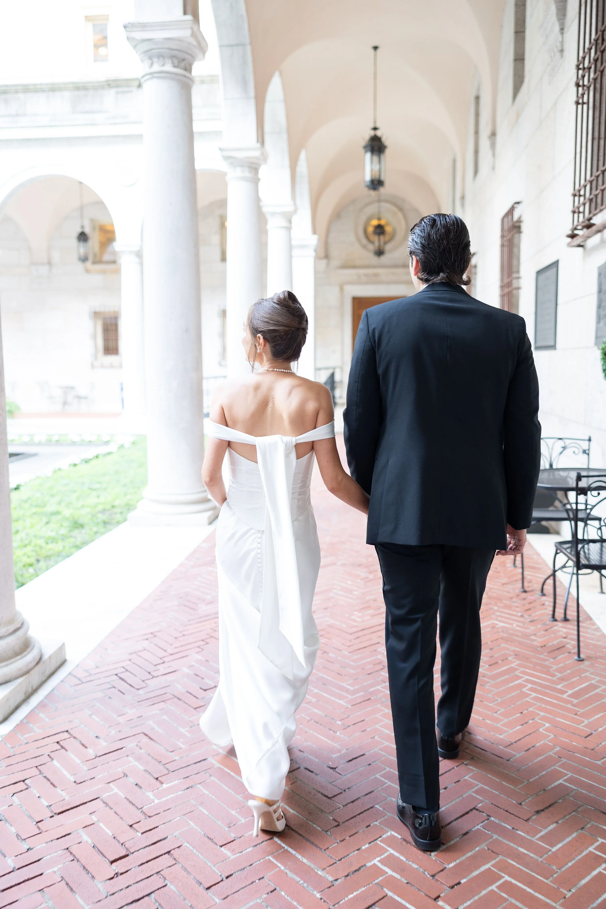 boston public library wedding bride  groom walking courtyard2
