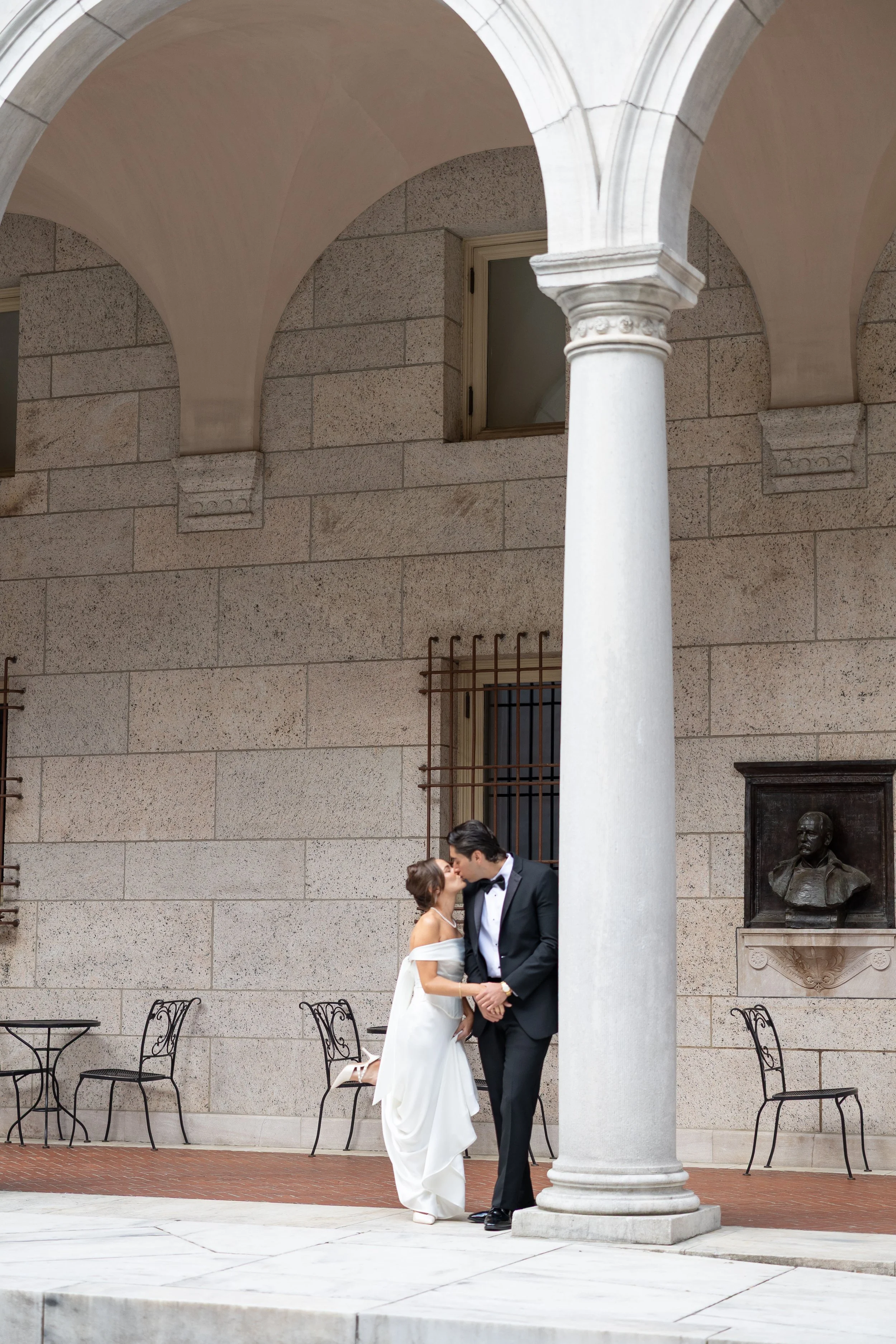 boston public library wedding bride  groom kiss courtyard