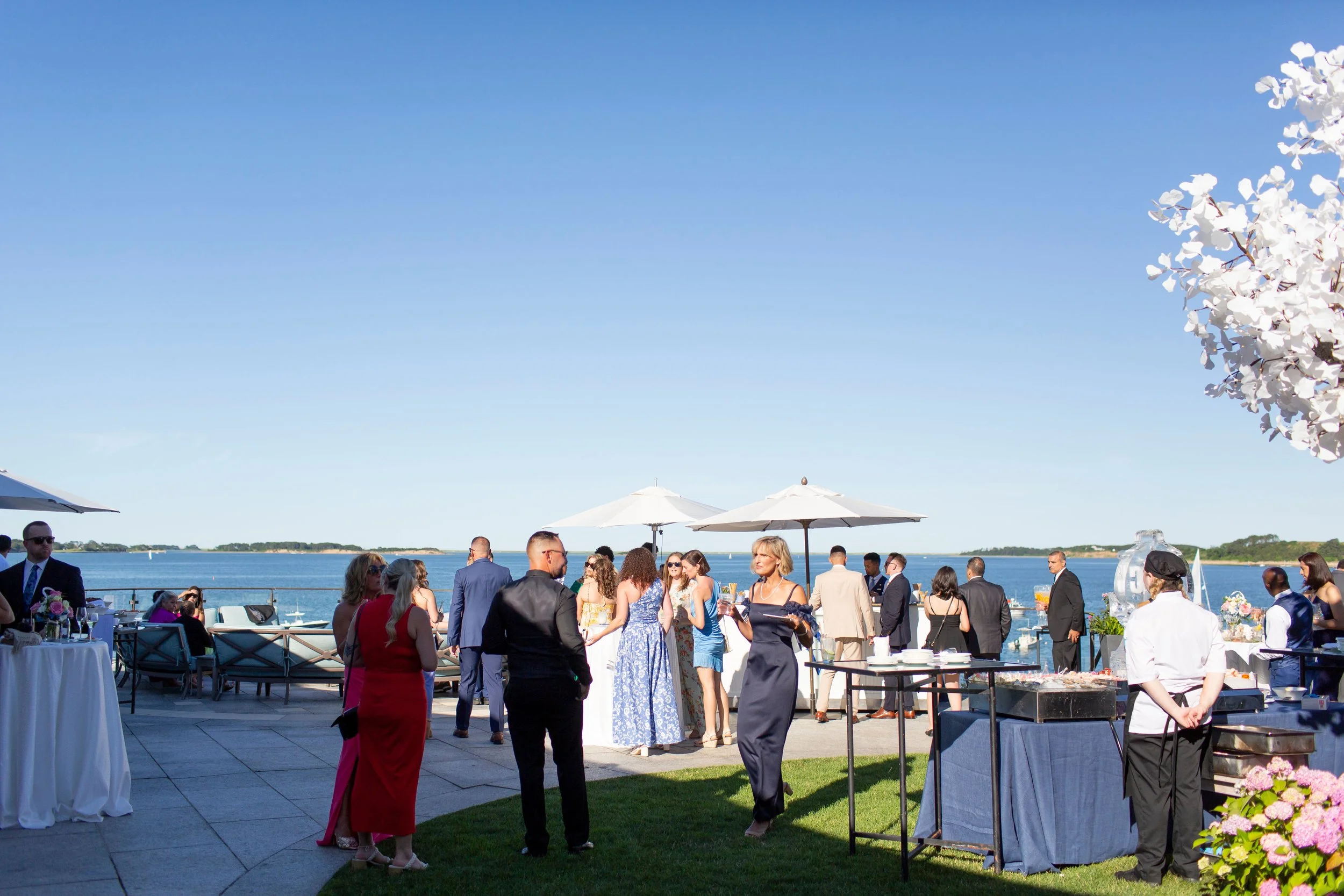 cape cod wedding wequassett wedding cocktail hour overlooking harbor