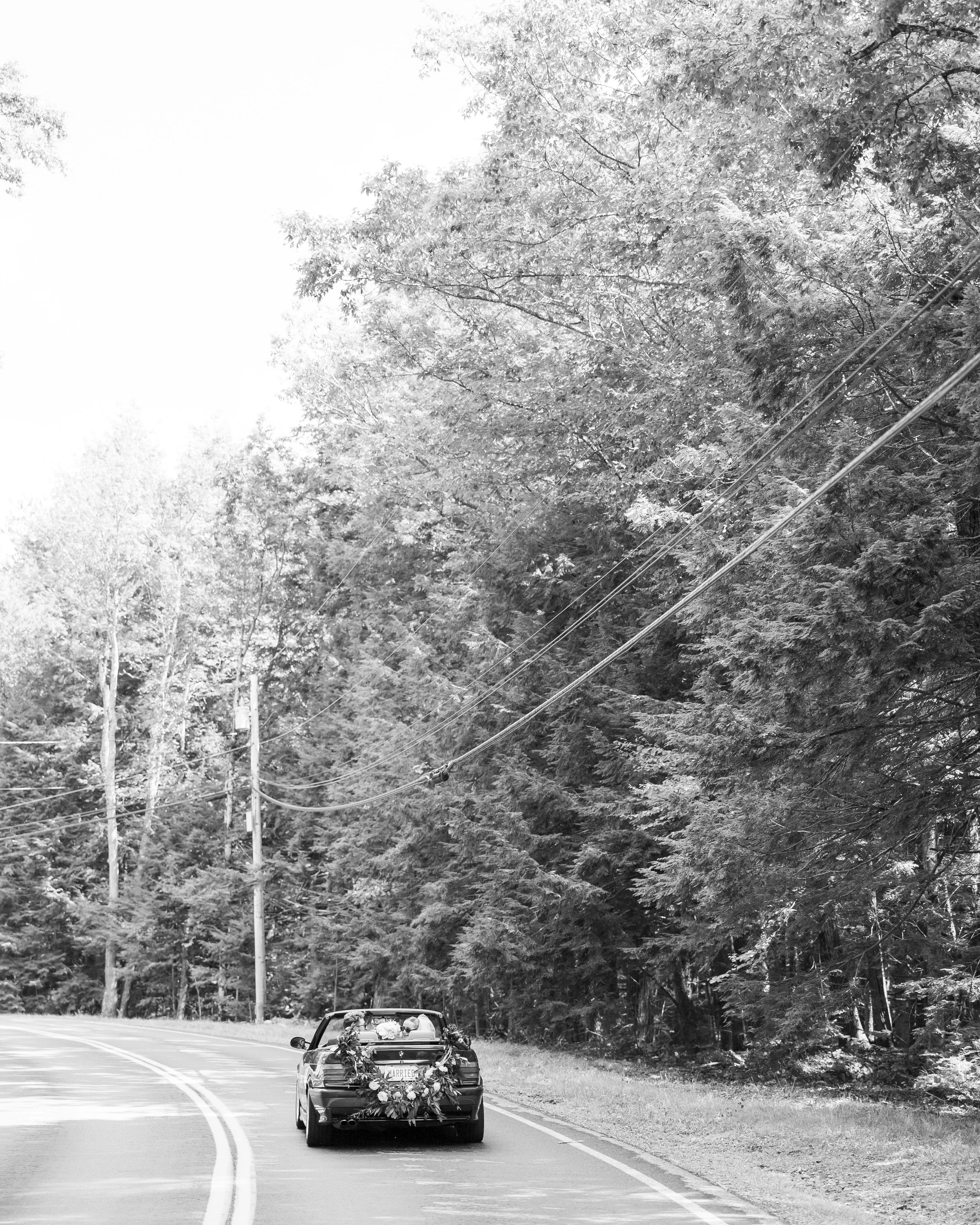 new hampshire wedding bride  groom driving in a convertible