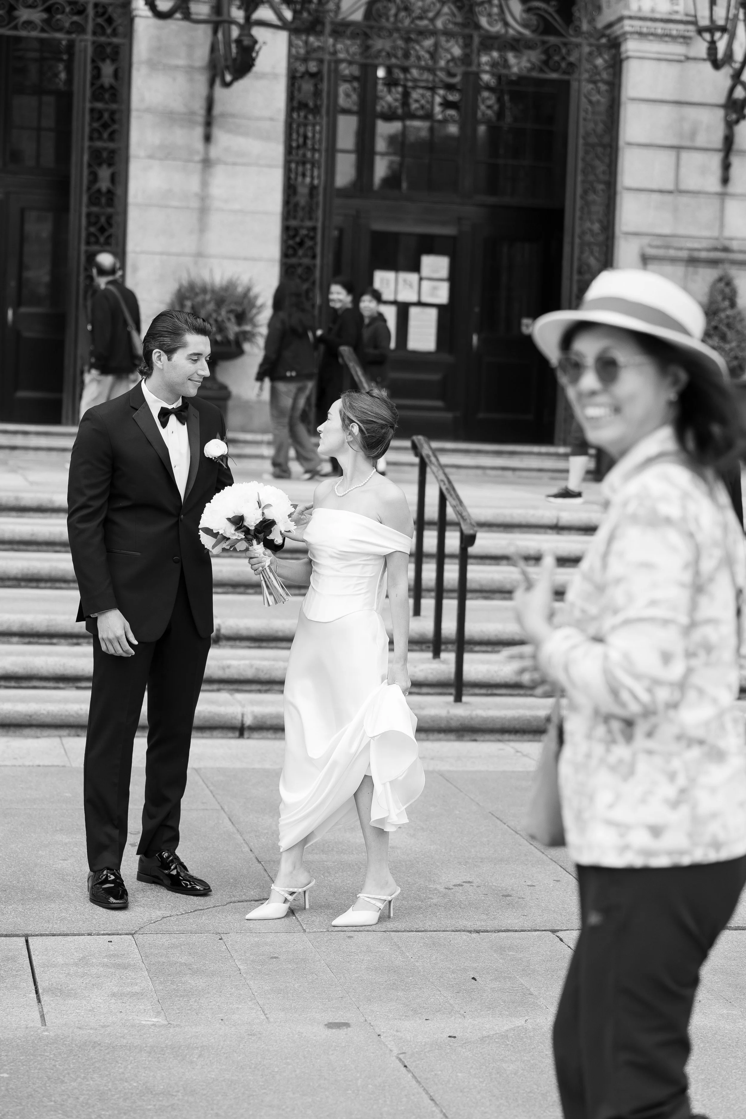 boston public library wedding bg bw candid photo with passersby