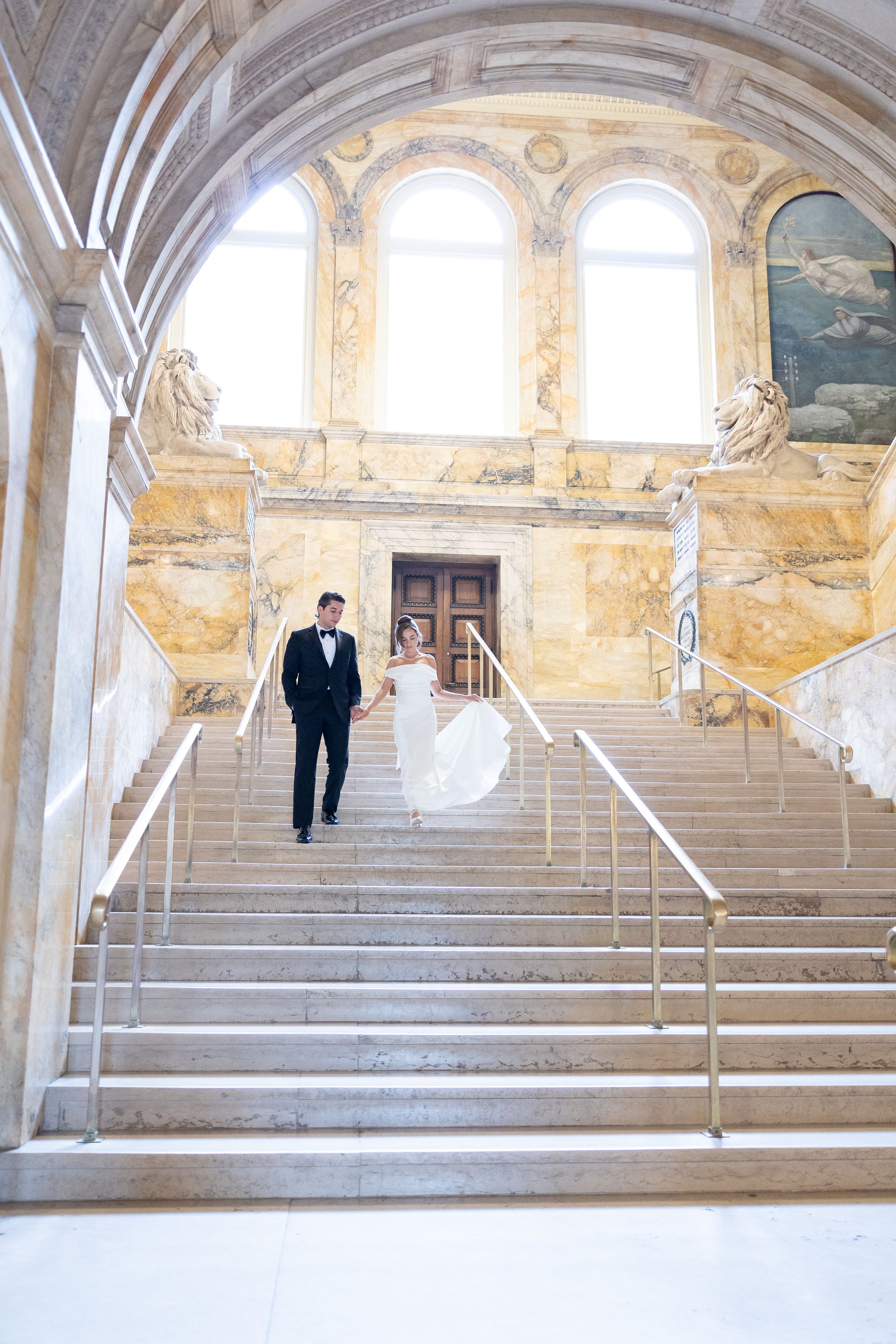 boston public library wedding bg walking main stairwell