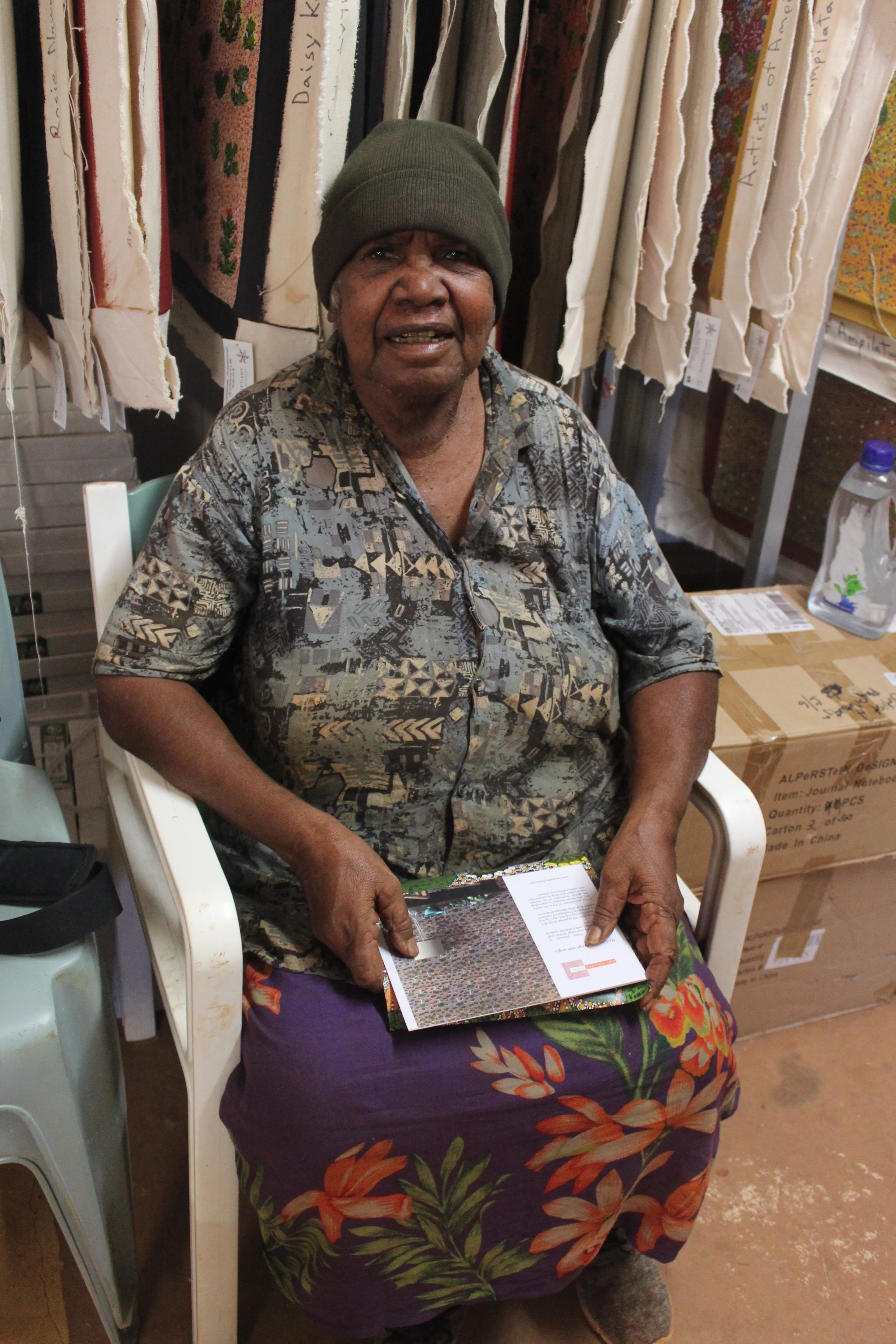 Lilly Kemarre Morton, artist whose work Bay Gallery Home used for 'My Country, Green" wallpaper. This image was taken while we were recently on her custodial lands in outback Australia. She was thrilled with how the artwork translated to wallpaper.