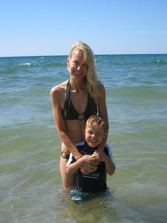 Heath and I (a few years back) at one of our summer happy places: Glen Arbor, Michigan. This photo was taken to prove that I do sometimes get (okay, once got) in the (freezing) Lake Michigan water.