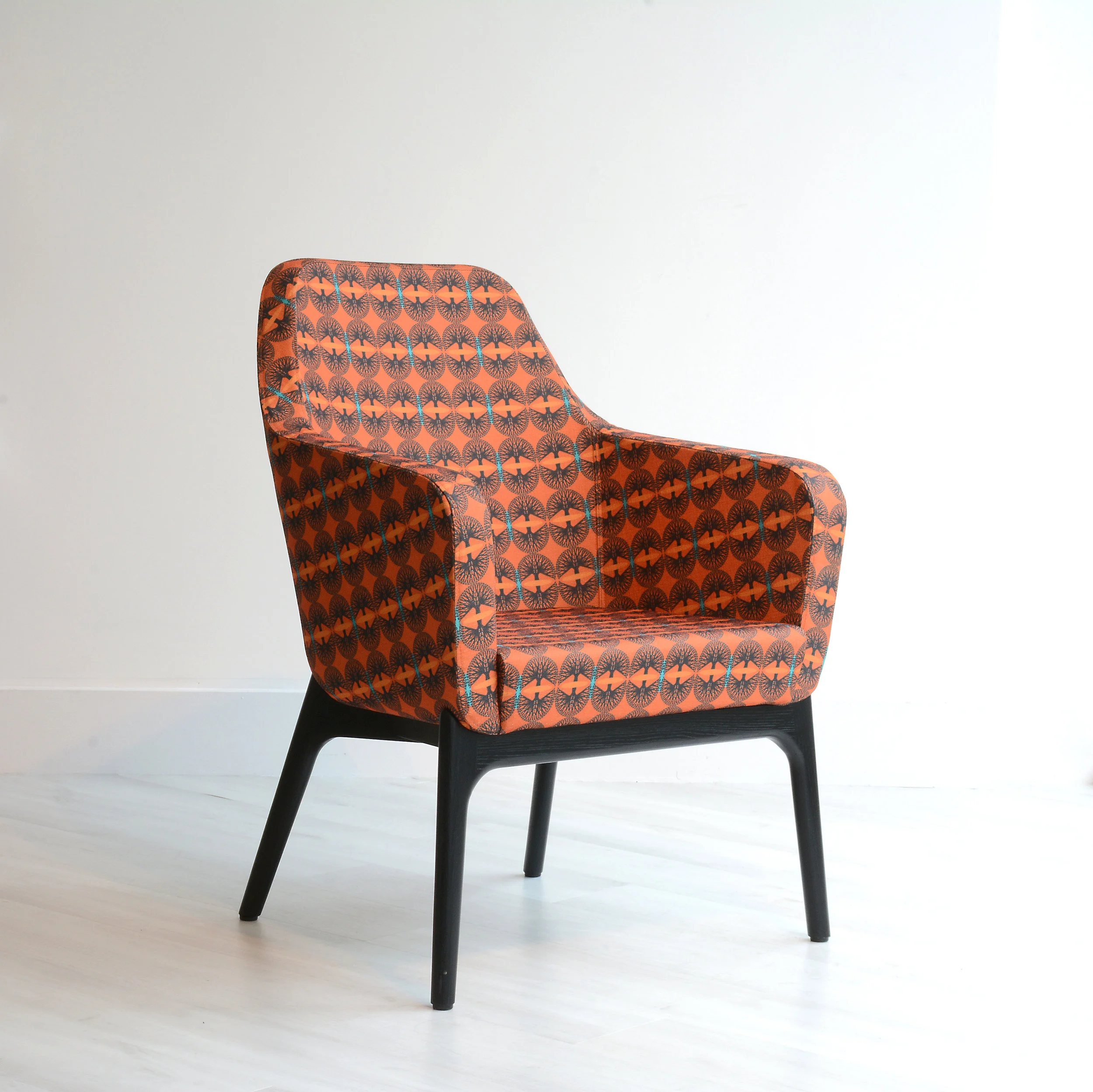 Harc tub chair designed by Roger Webb associates and upholstered in our Simon Strand 009