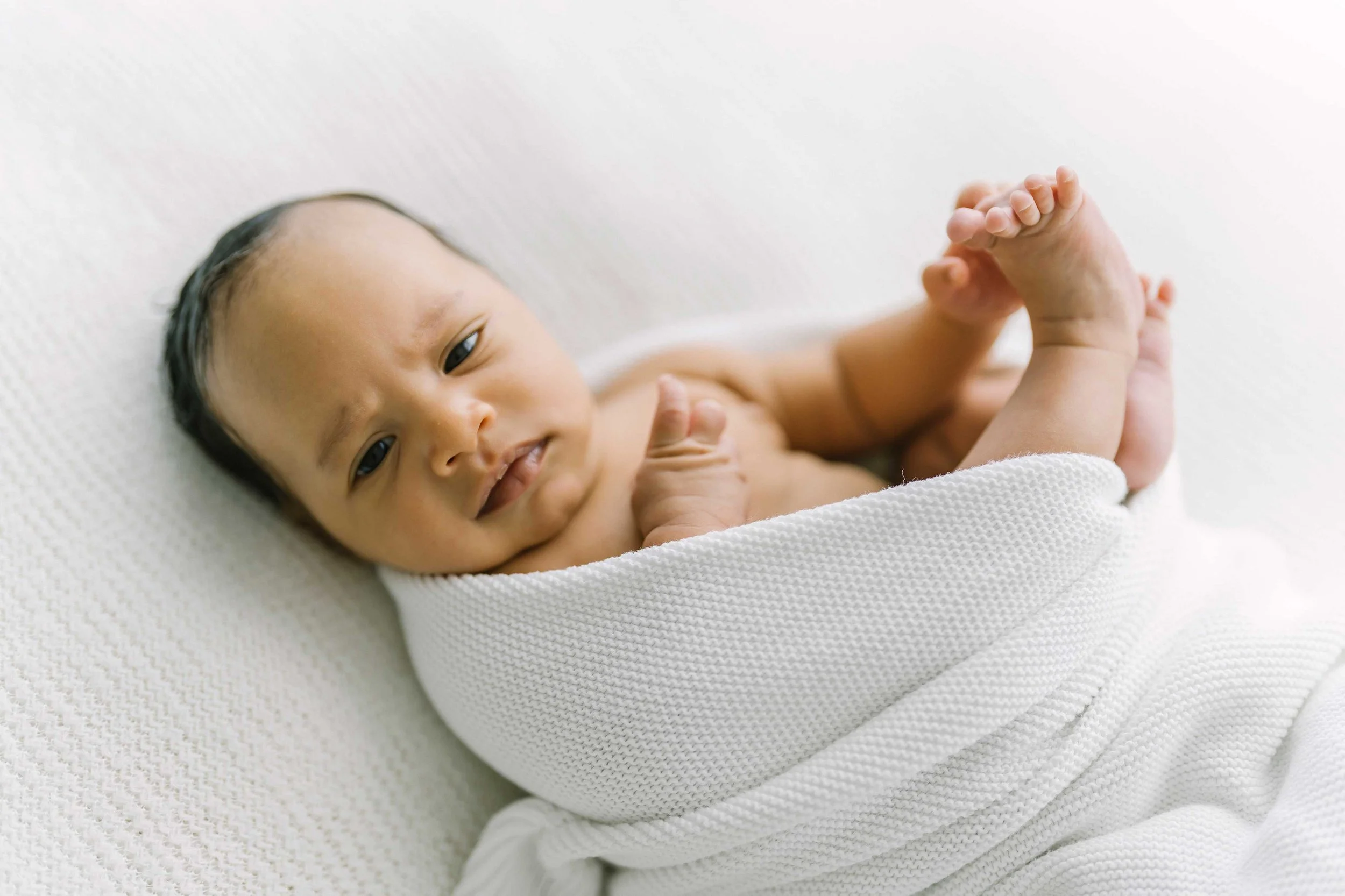 Natural newborn photography session featuring an awake baby in Grimsby Ontario