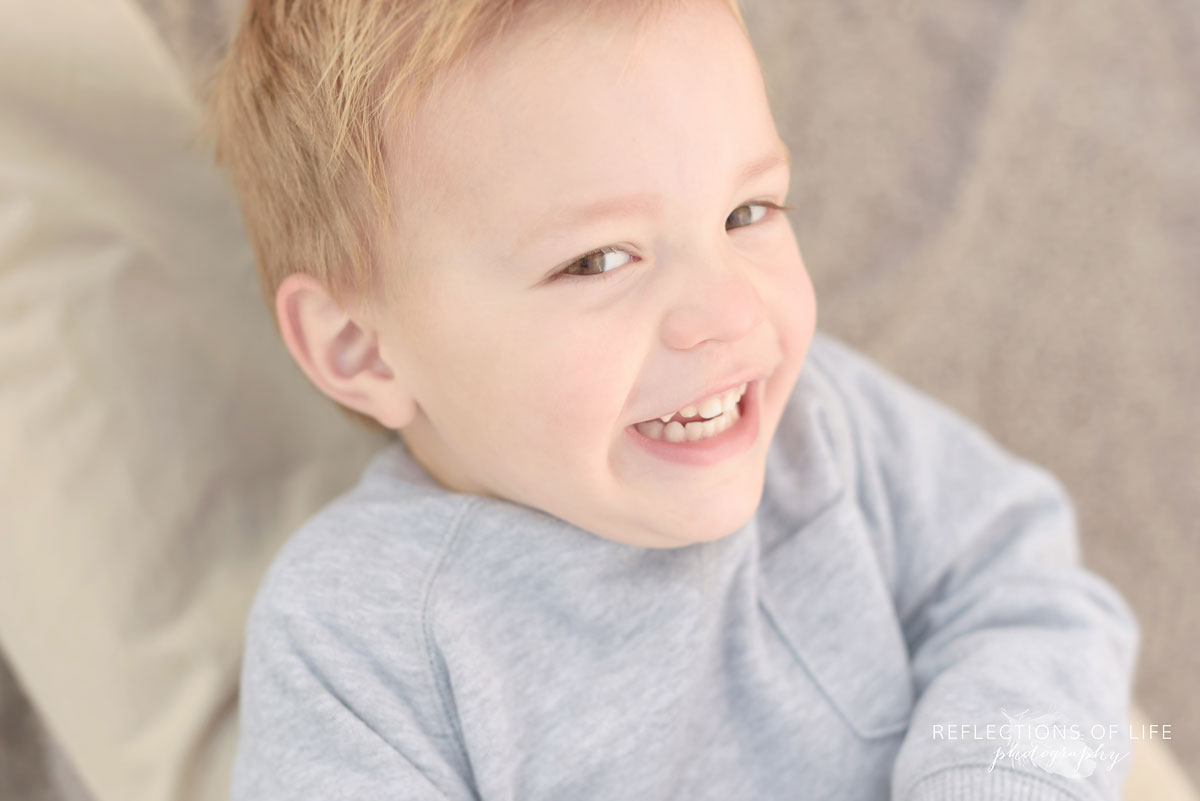 little boy laughing professional photographer grimsby ontario