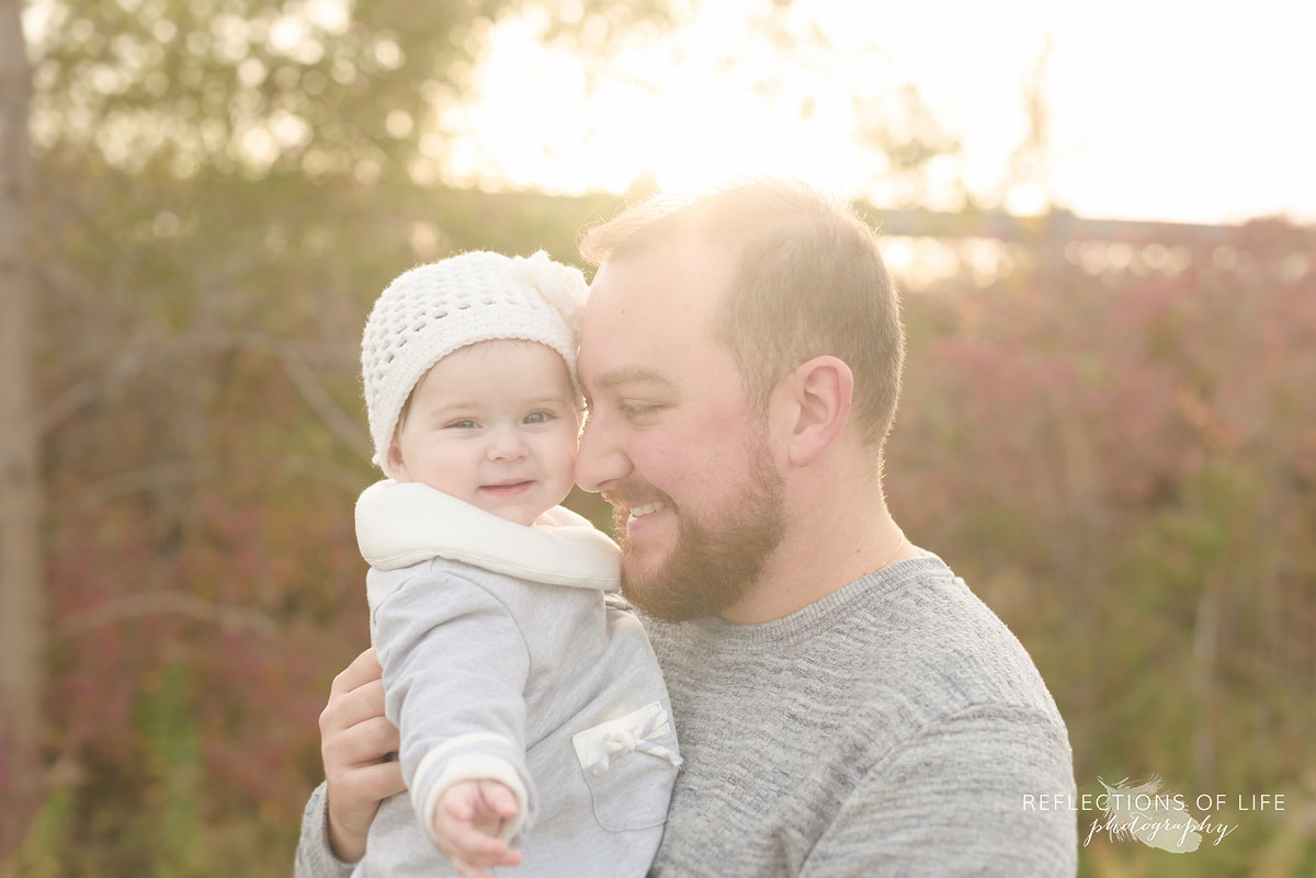 Daddy hugs his daughter authentic family portrait Southern Ontario