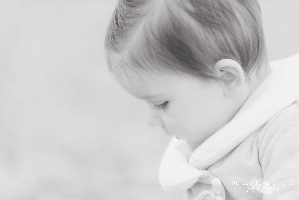 peaceful baby portraits on the beach in Ontario Canada