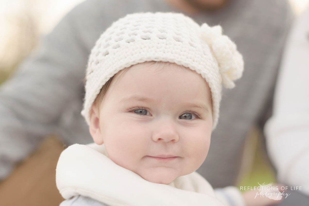 little girl baby on the beach smiling into the sunset Grimsby Ontario Canada