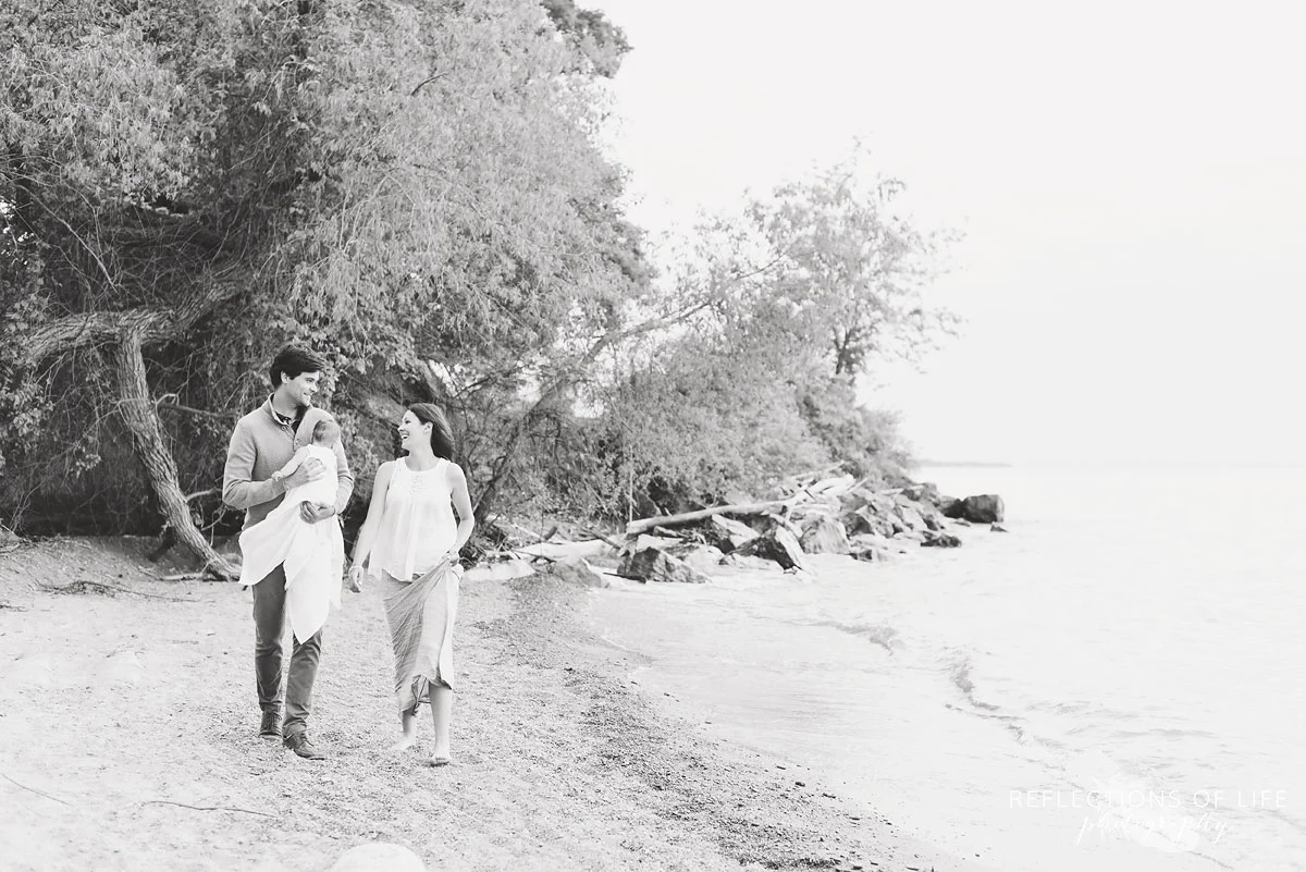 Niagara family photos on the beach laughing and walking together
