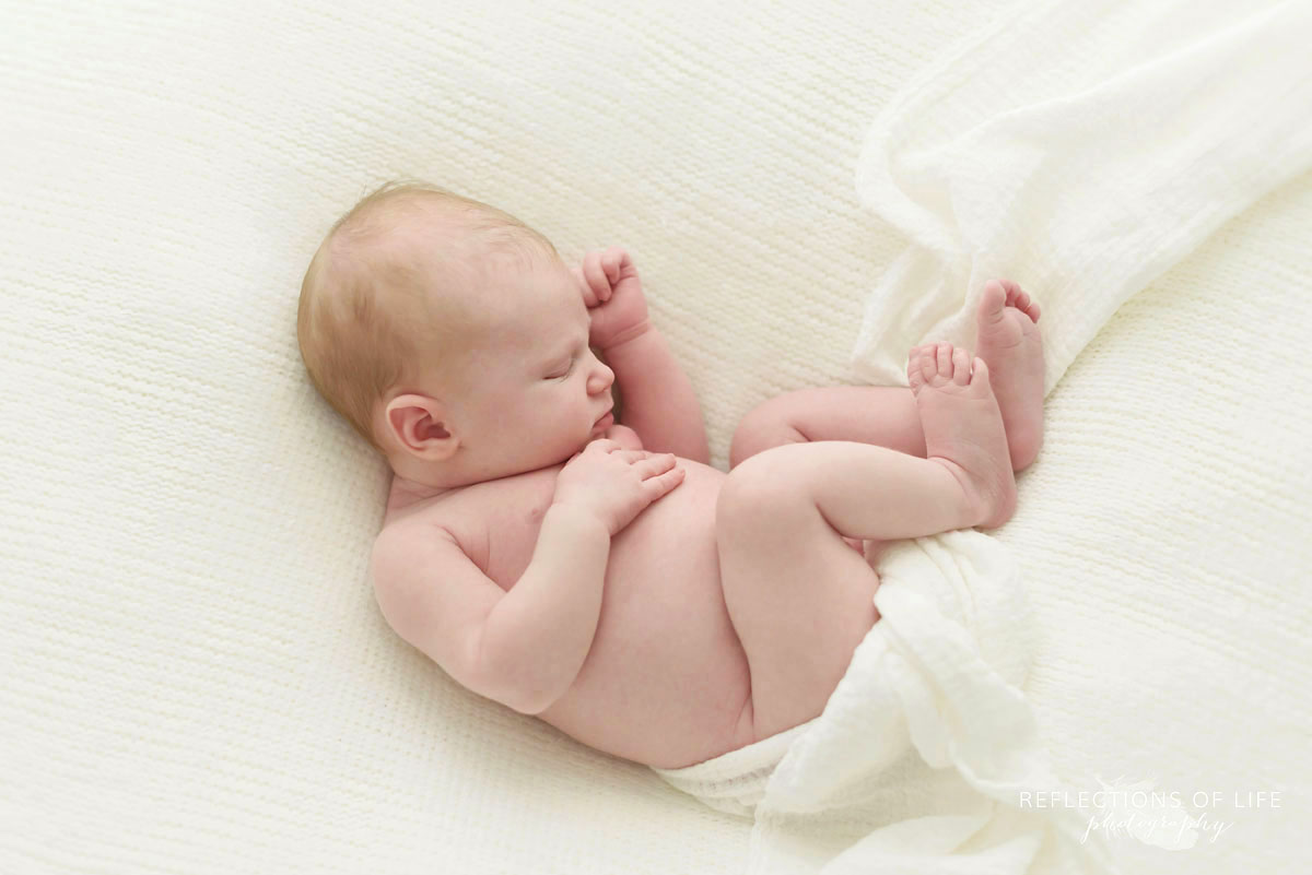 002 Top Ten Favourite Newborn Images baby curlled up in a blanket