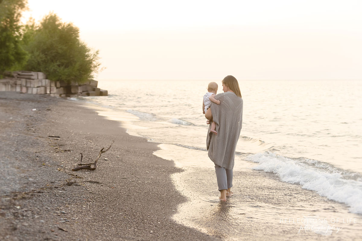 008 Mother daughter walking on the beach together in Niagara Ontario Canada