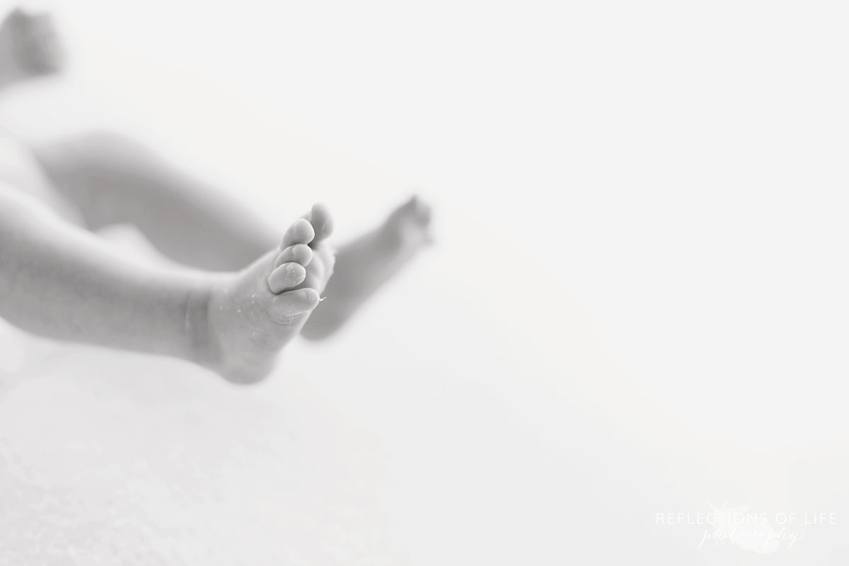 newborn baby boy toes as he stretches in Grimsby photo studio 012