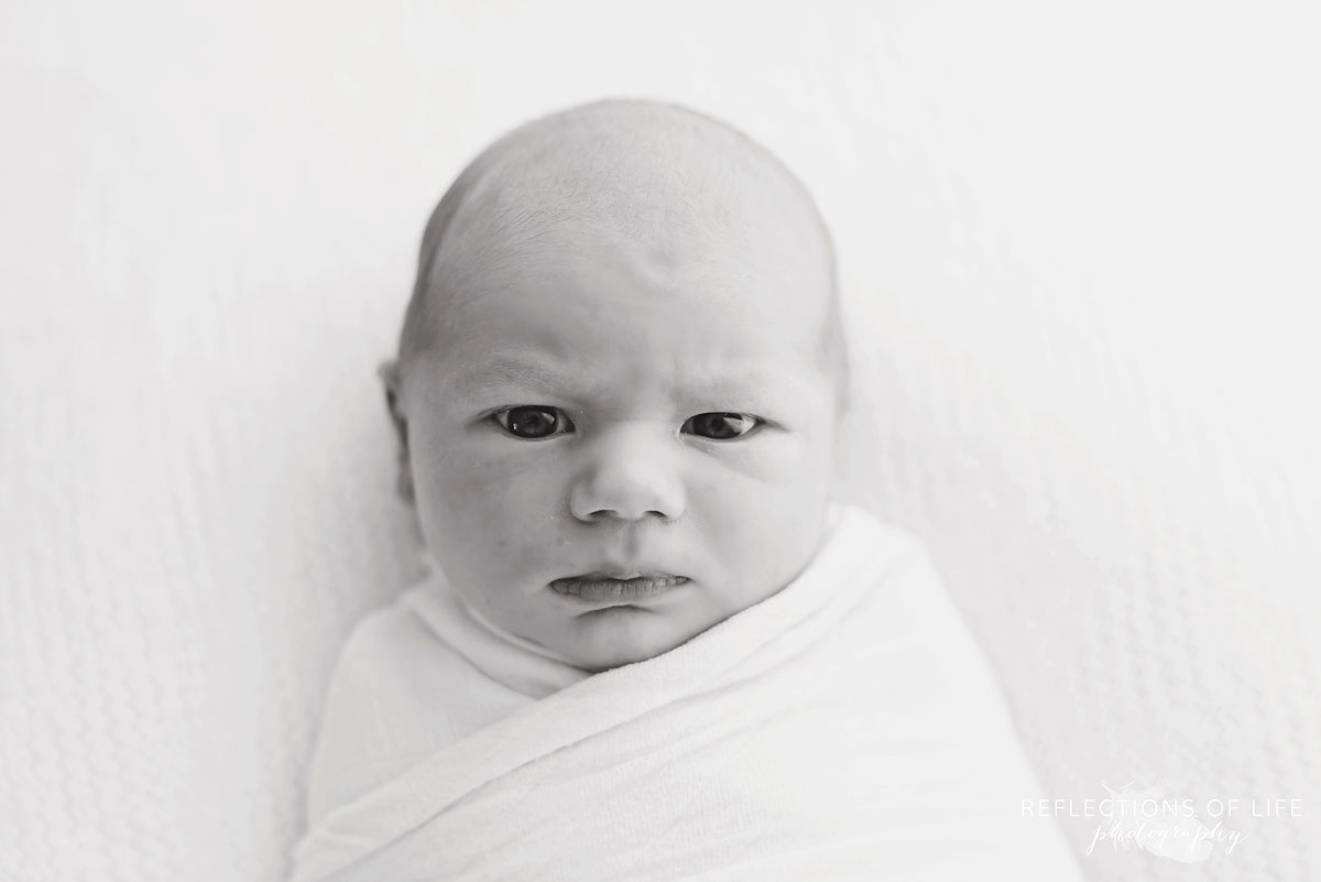 Niagara Newborn Photography Black and white image of a newborn baby