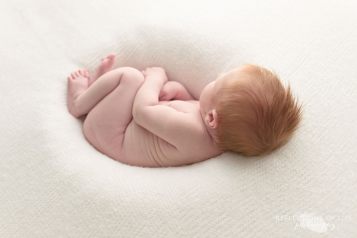 Colour photo of redhead newborn baby boy