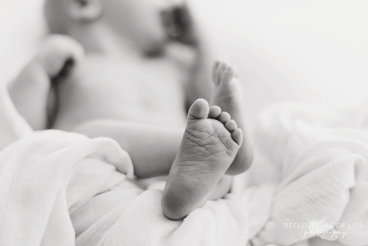 Black and white image of newborn Baby feet