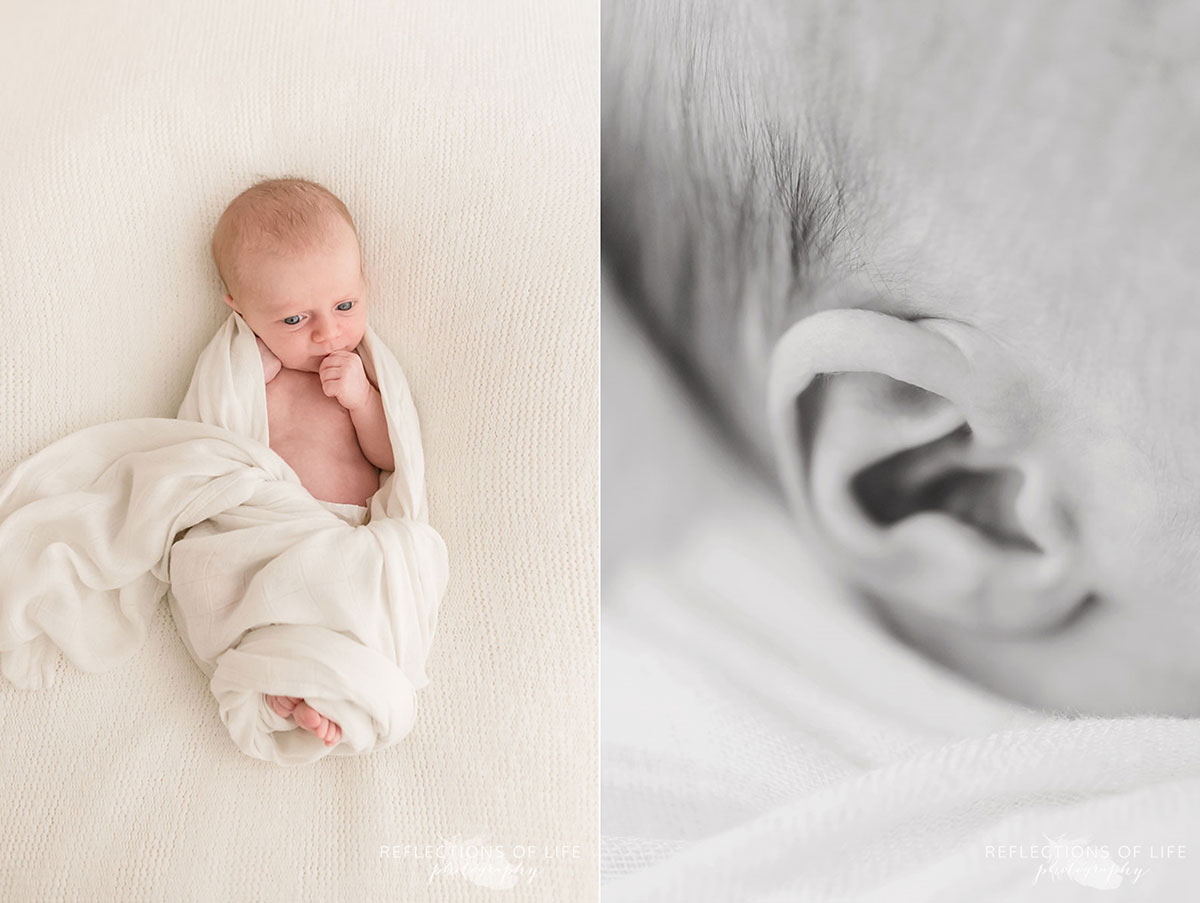 Newborn baby girl swaddled in white Niagara Newborn Photographer