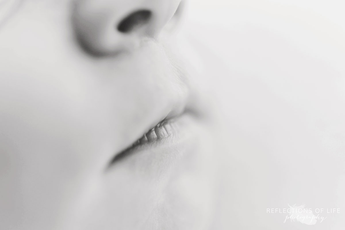 Black and white photo of newborn baby boy lips