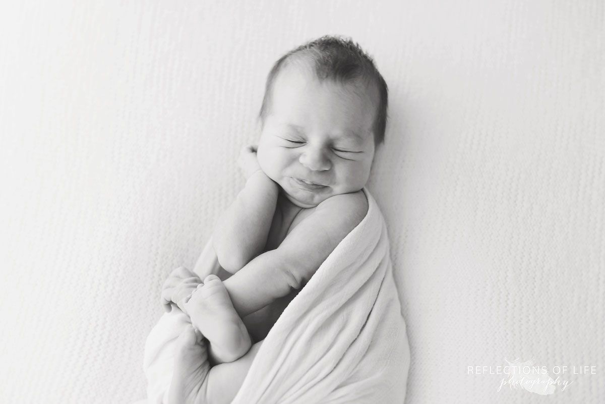 Cute photo of newborn baby boy stretching