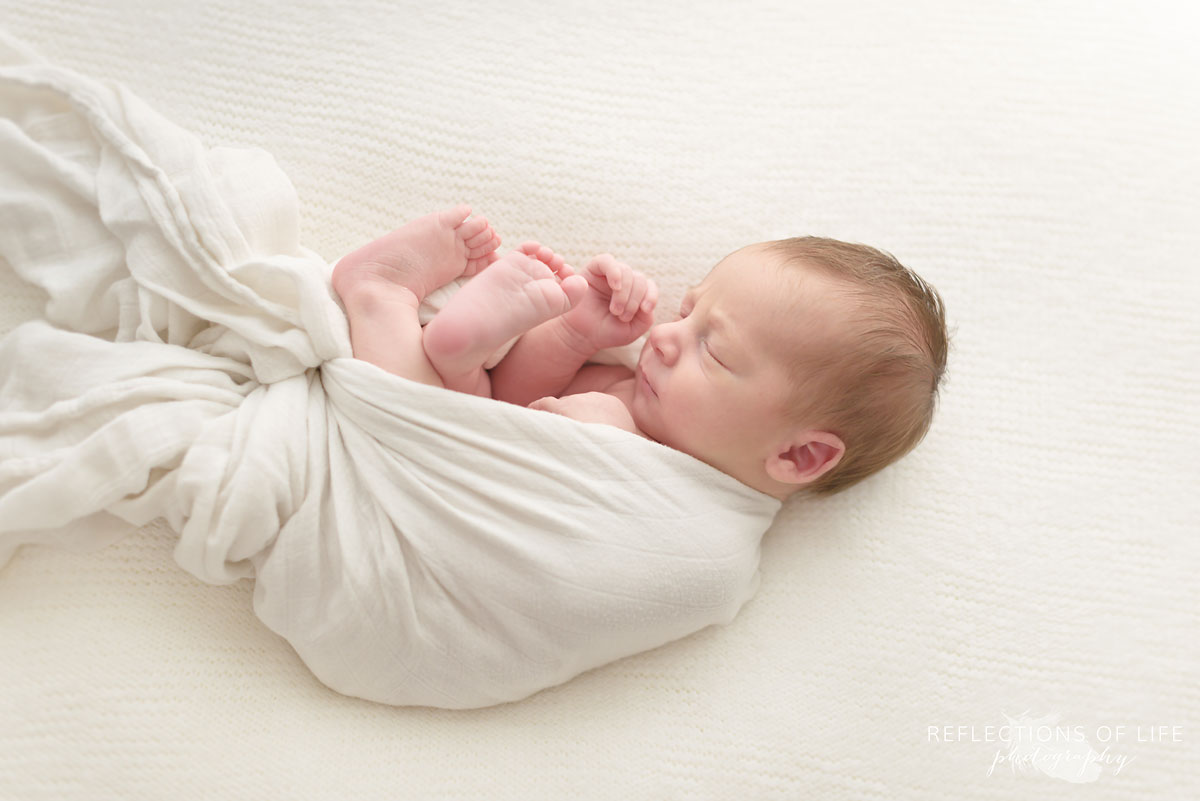 Newborn baby boy Austin wrapped in white