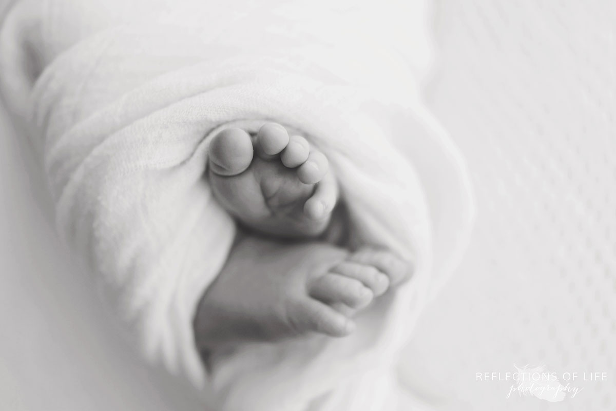 Newborn baby toes in black and whtie