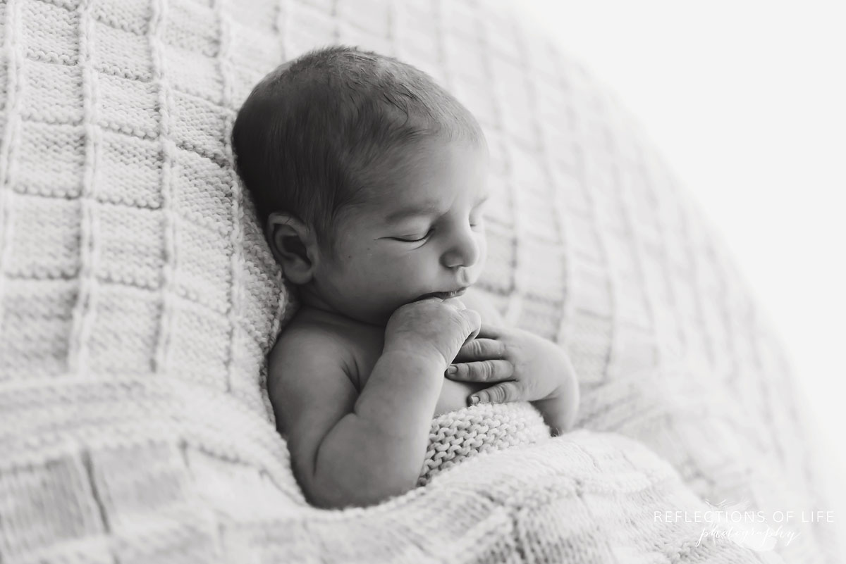 Black and white photo of baby sleeping in Grimsby Ontario Photo Studio