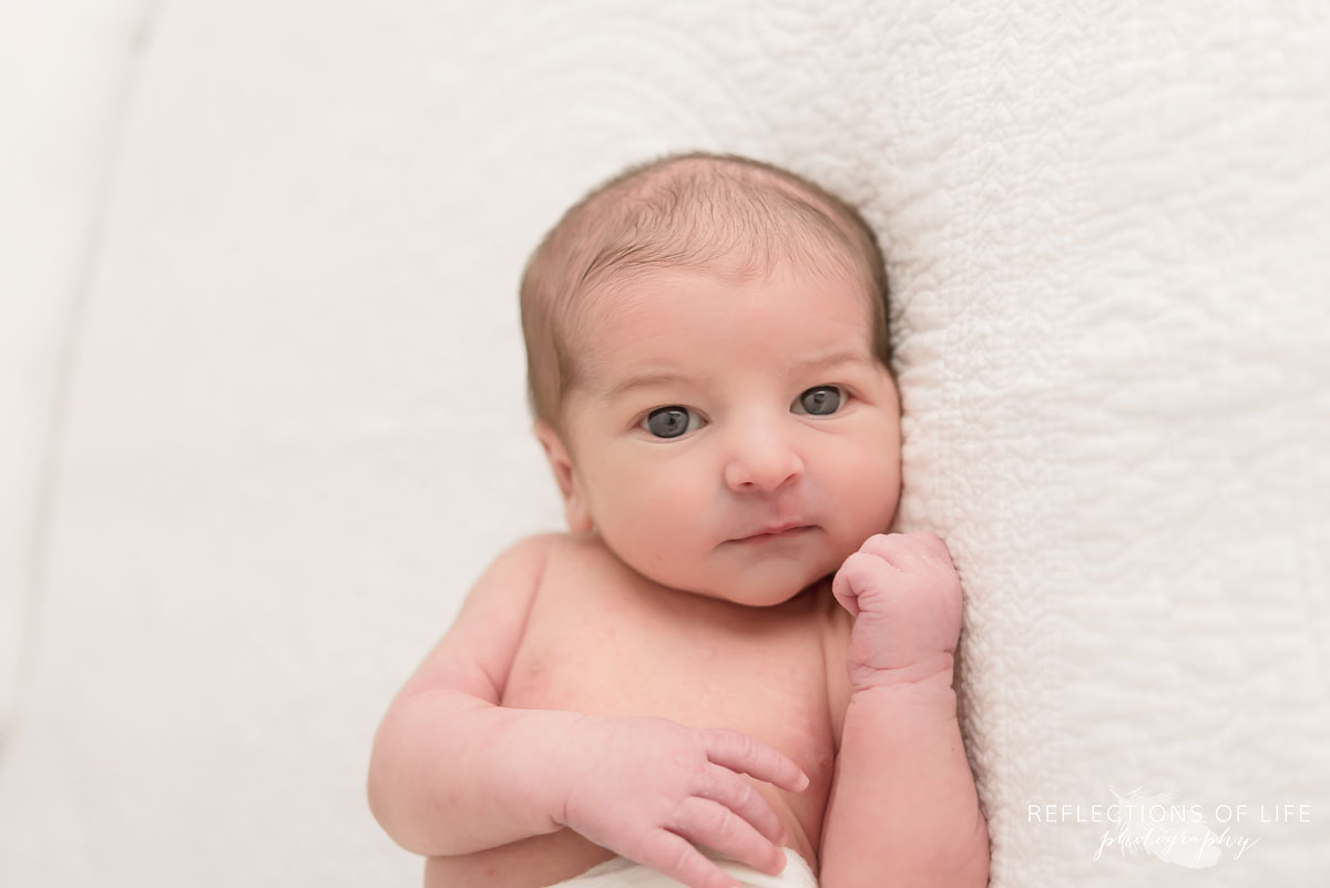 Wide eyed baby boy Niagara Newborn Photography