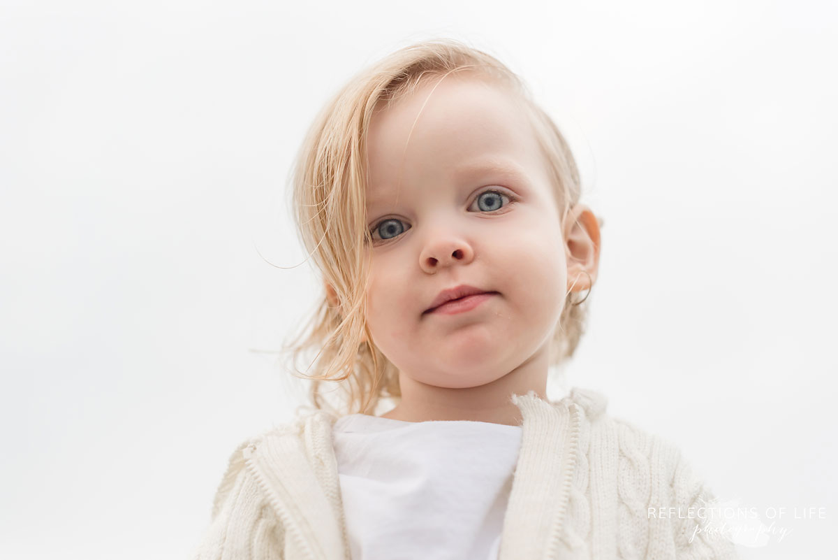 Photo of gorgeous toddler boy looking down at the camera.jpg
