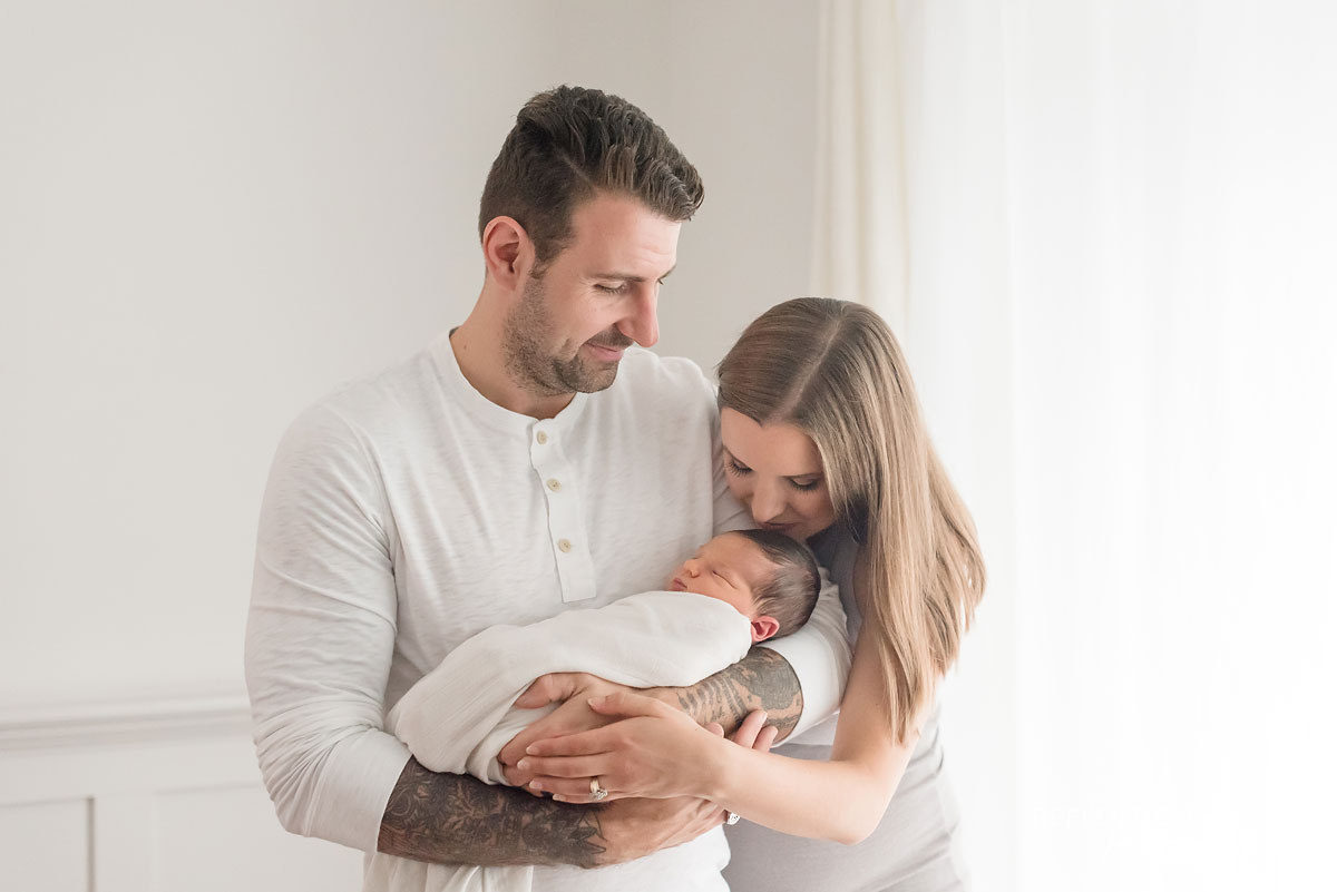 Professional Newborn portrait of baby and his parents