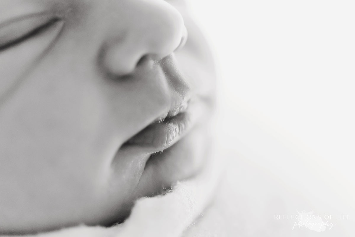 Newborn baby lips in black and white