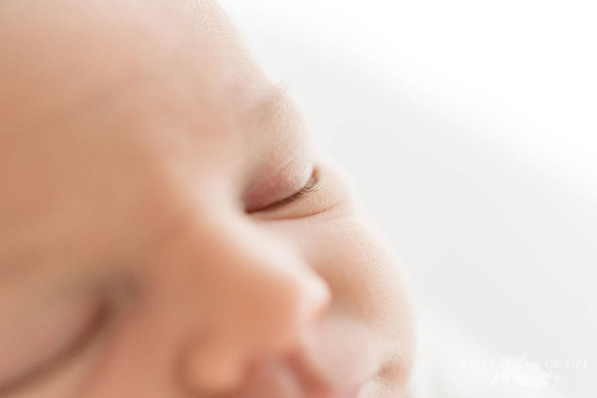 Close up image of newborn baby eyelashes
