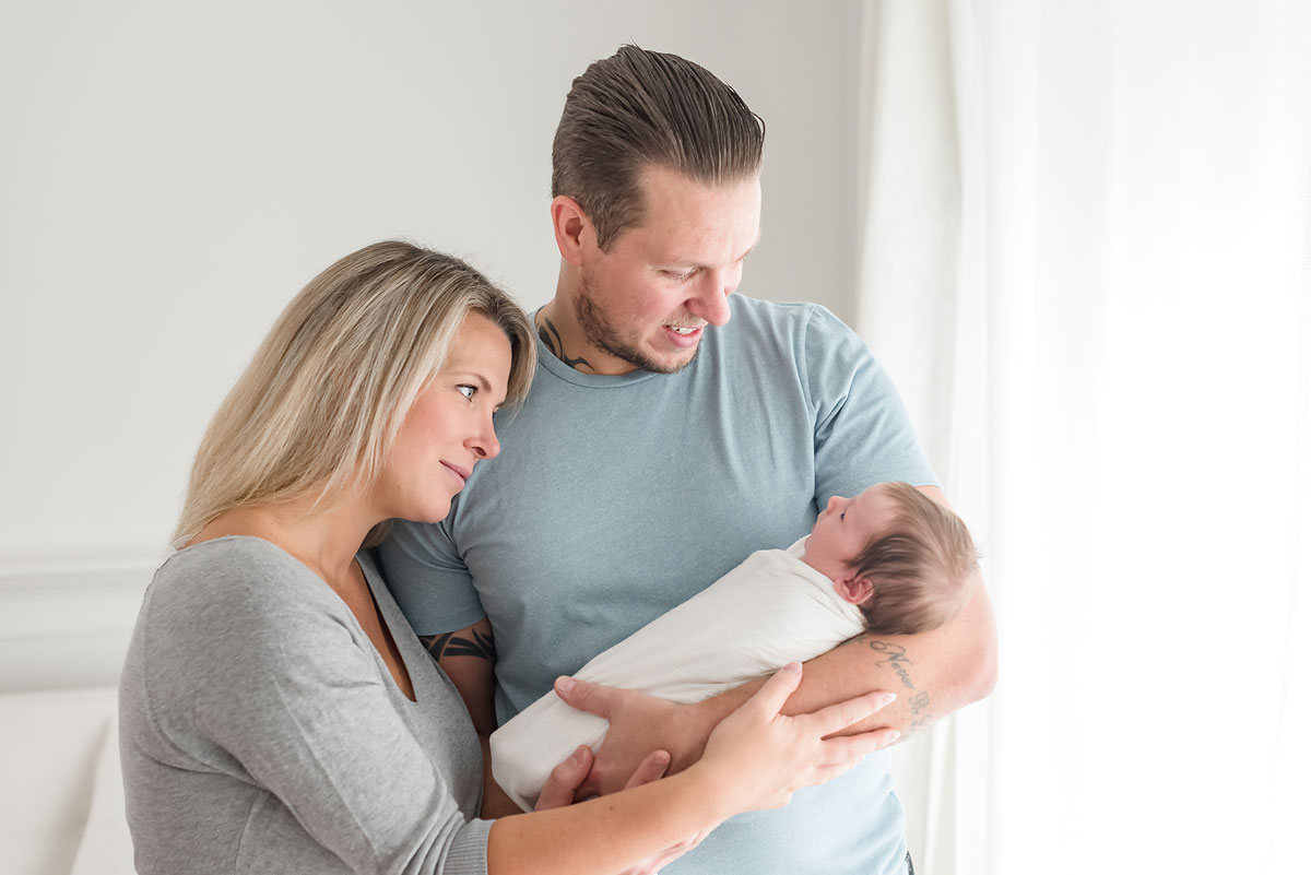 012 Mom and dad looking down at their newborn baby boy.jpg