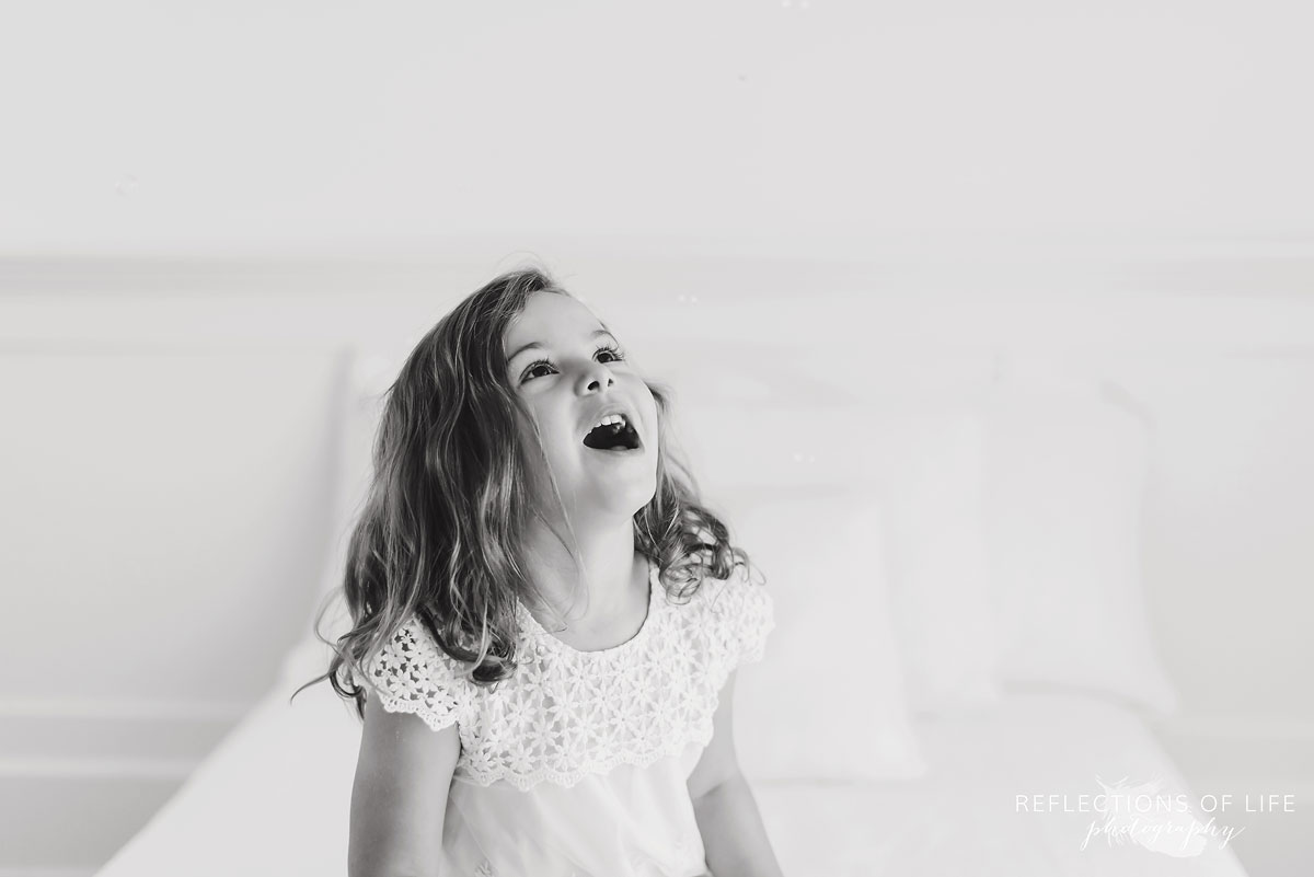 Little girl laughing Fun childrens photography Grimsby Ontario